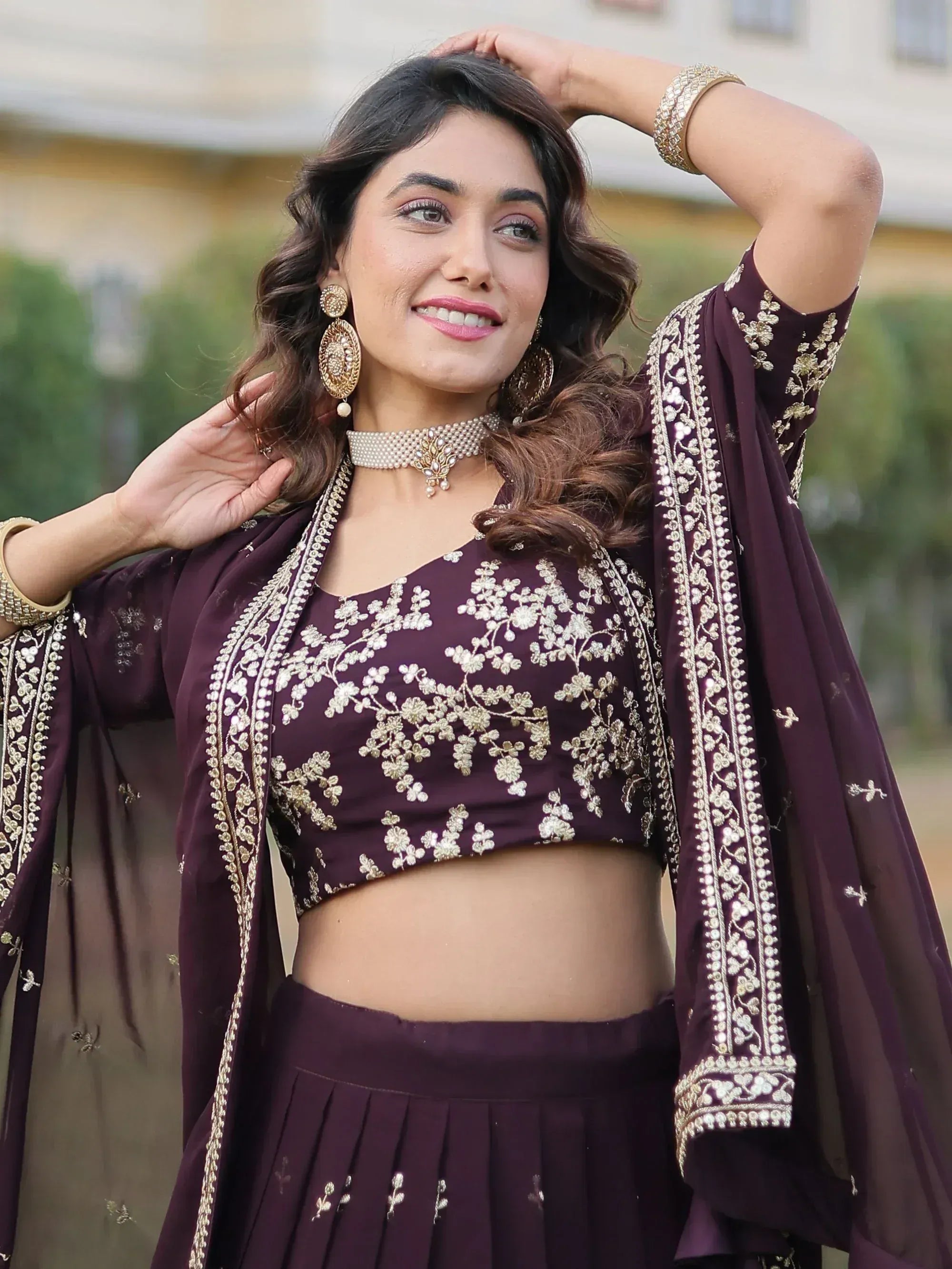 Elegant maroon lehenga choli with gold floral embroidery, perfect for Indian ethnic wear occasions