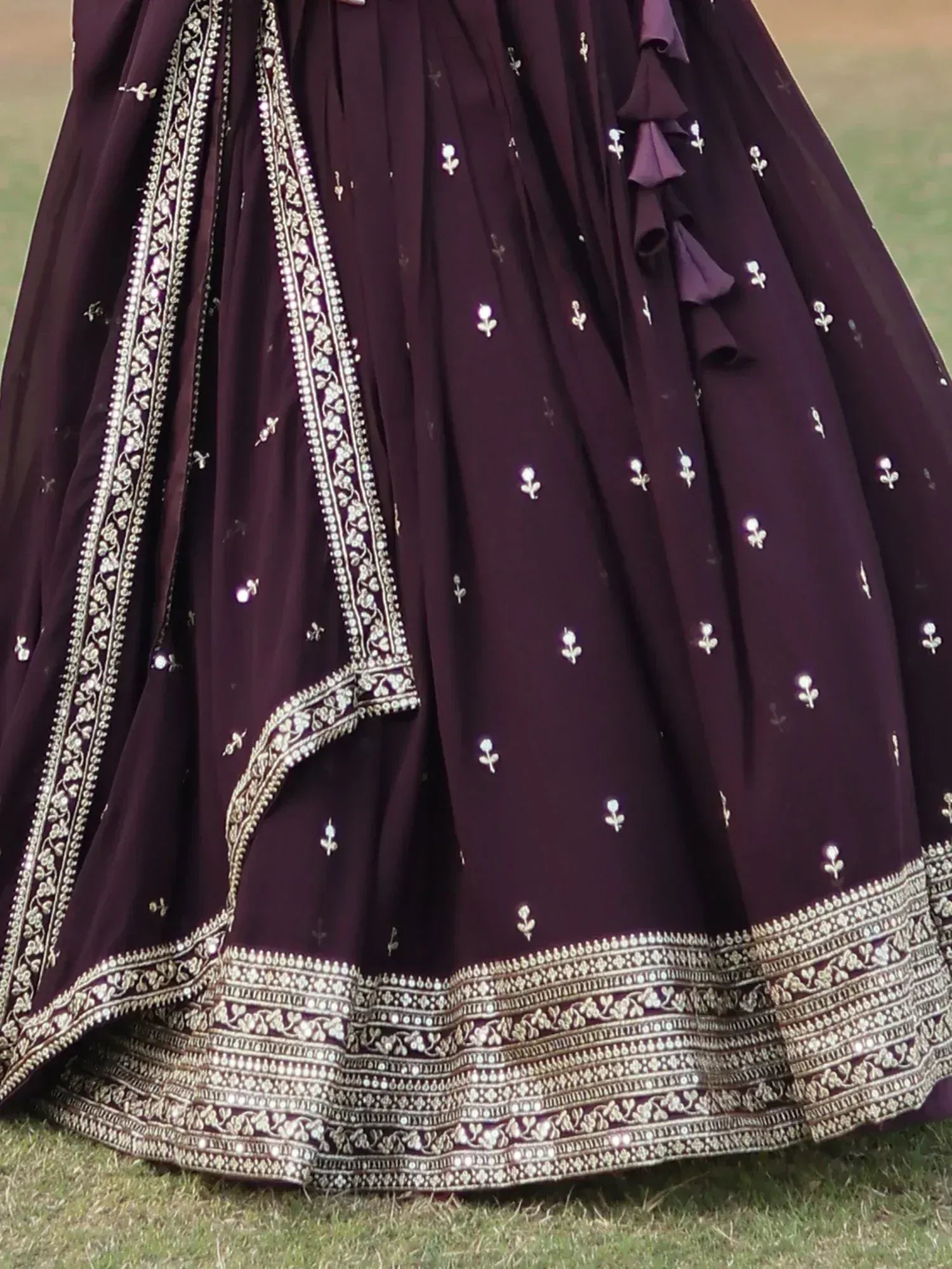 Elegant purple lehenga with intricate silver embroidery and floral motifs, perfect for Indian ethnic wear.