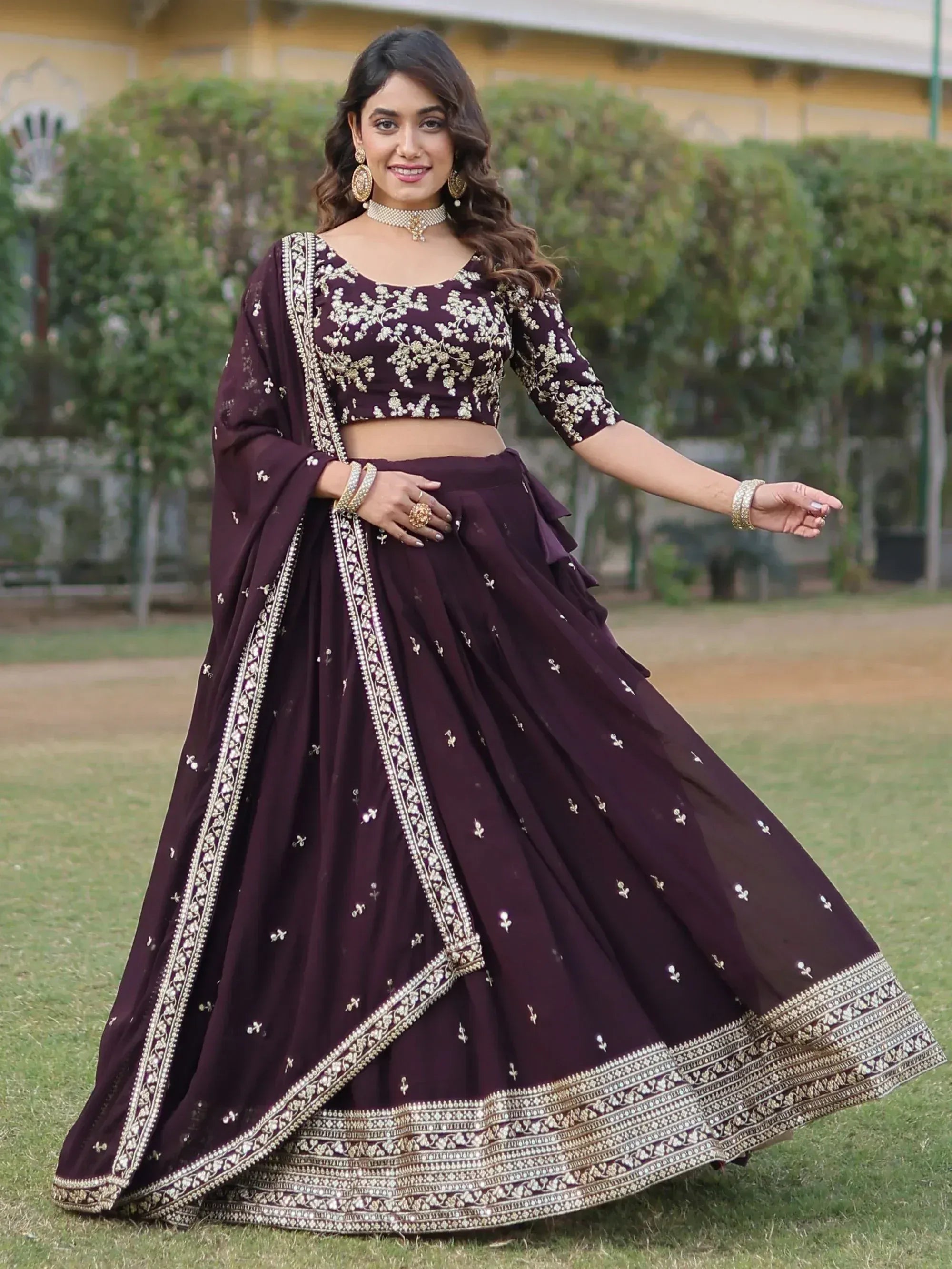 Elegant maroon lehenga choli with gold embroidery, perfect for Indian ethnic wear events