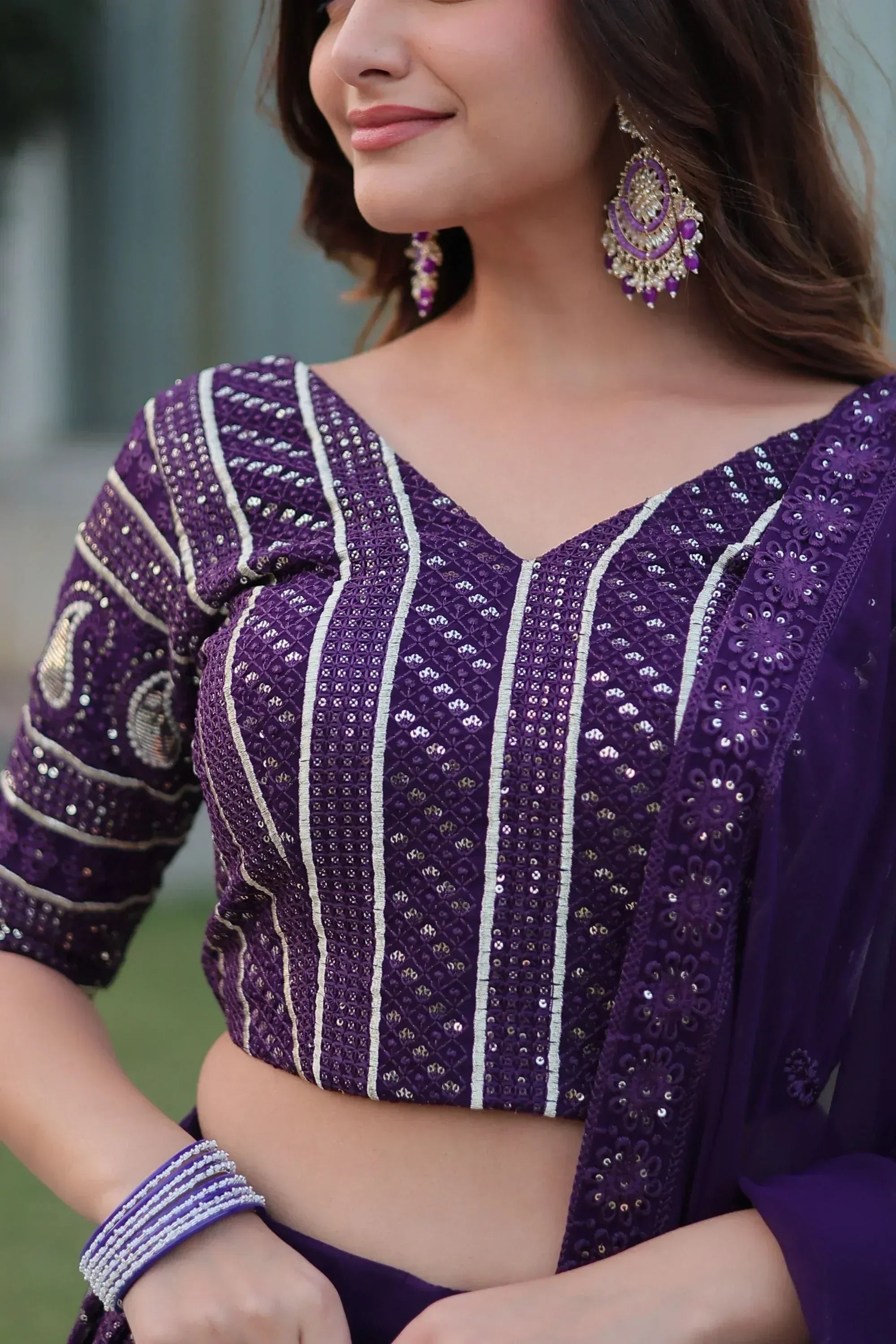 Purple embroidered lehenga choli with sequins and matching earrings, Indian ethnic wear