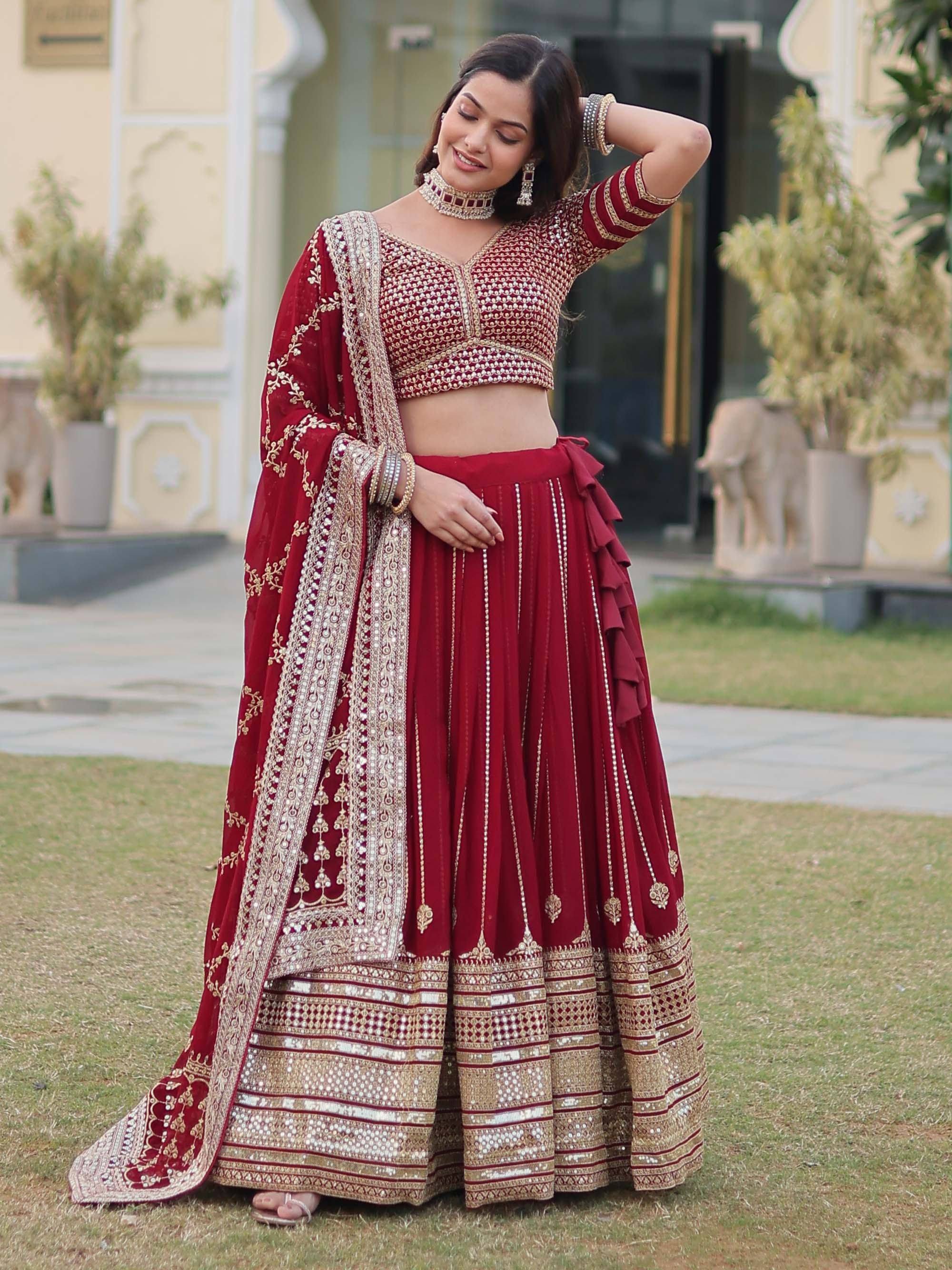Maroon designer lehenga choli with gold embroidery, perfect for Indian weddings and festive occasions