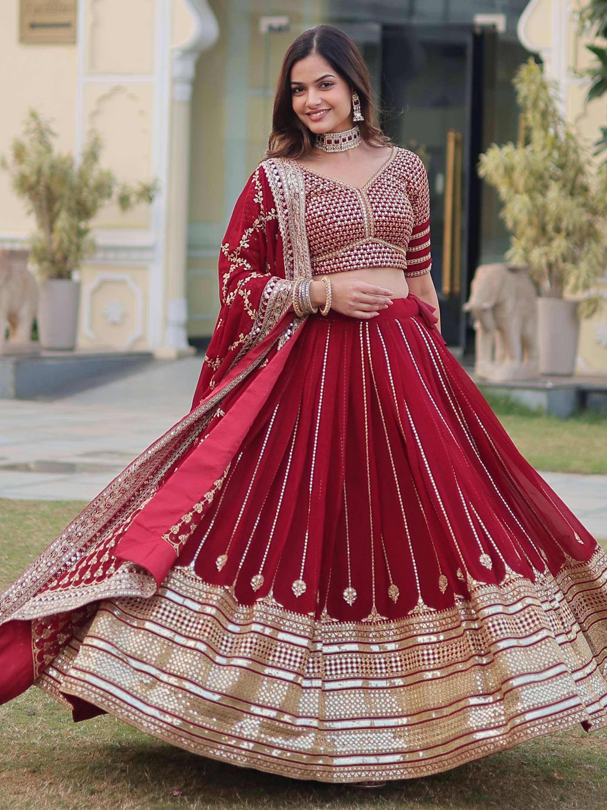 Red designer lehenga choli with gold embroidery, perfect for Indian weddings and festive occasions