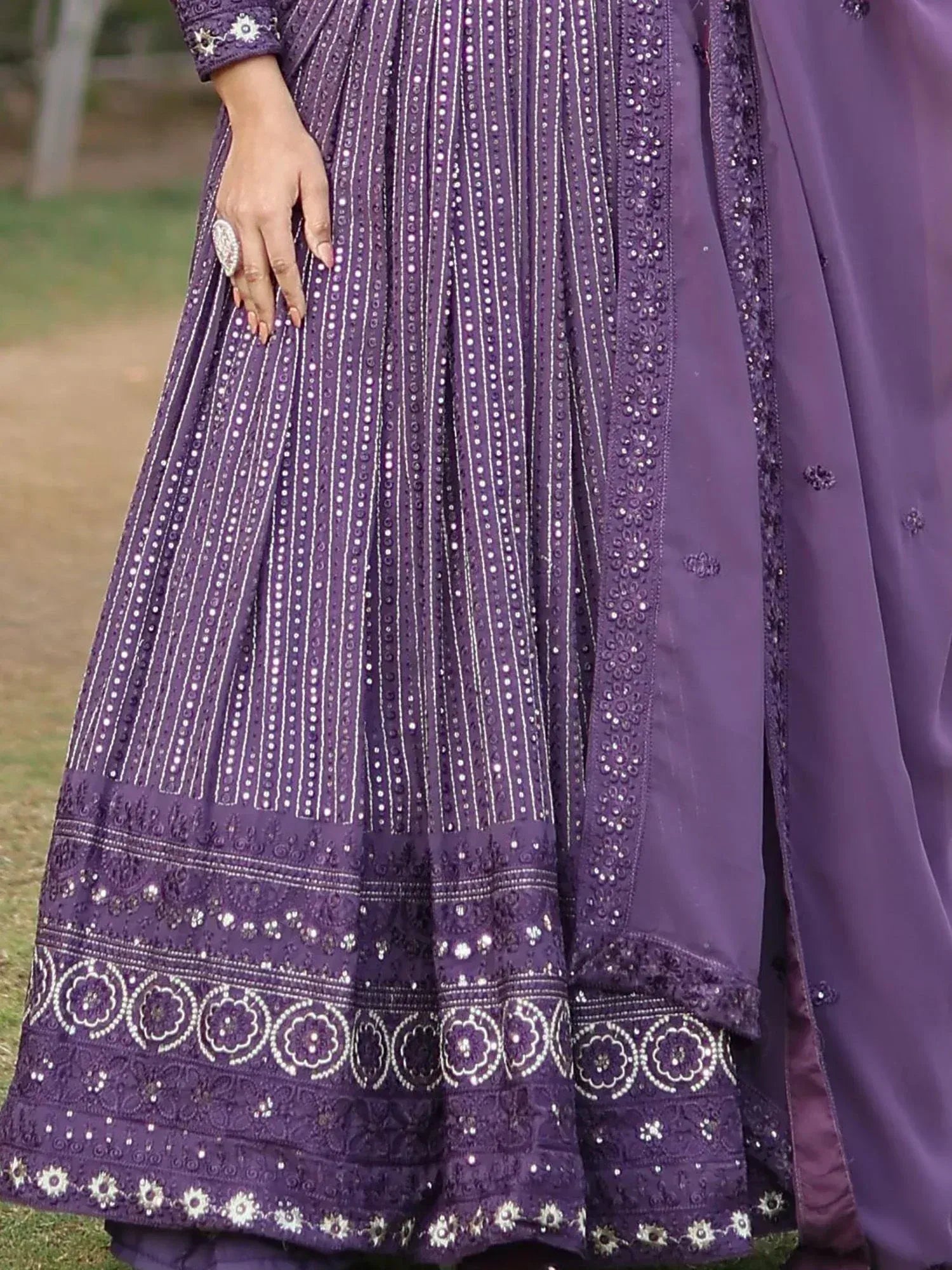 Purple embroidered lehenga choli with mirror work and floral border, perfect for Indian ethnic occasions