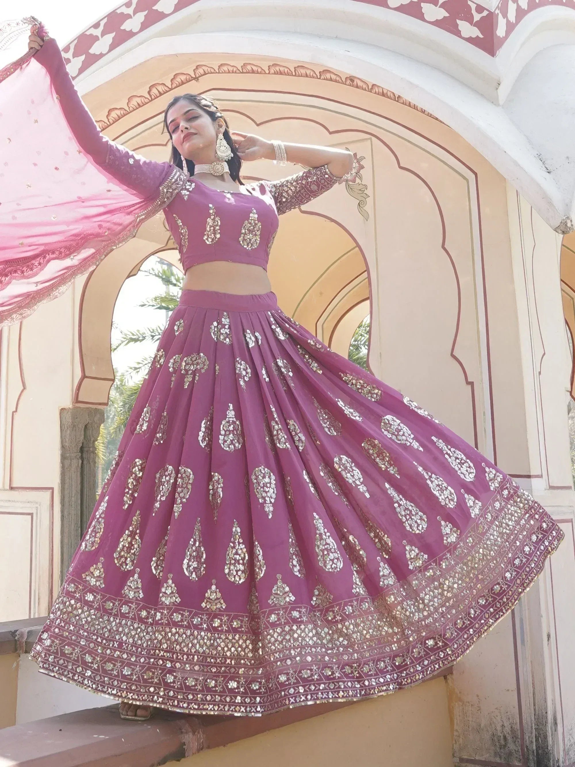 Elegant purple lehenga choli with mirror work, perfect for Indian weddings and festive occasions.
