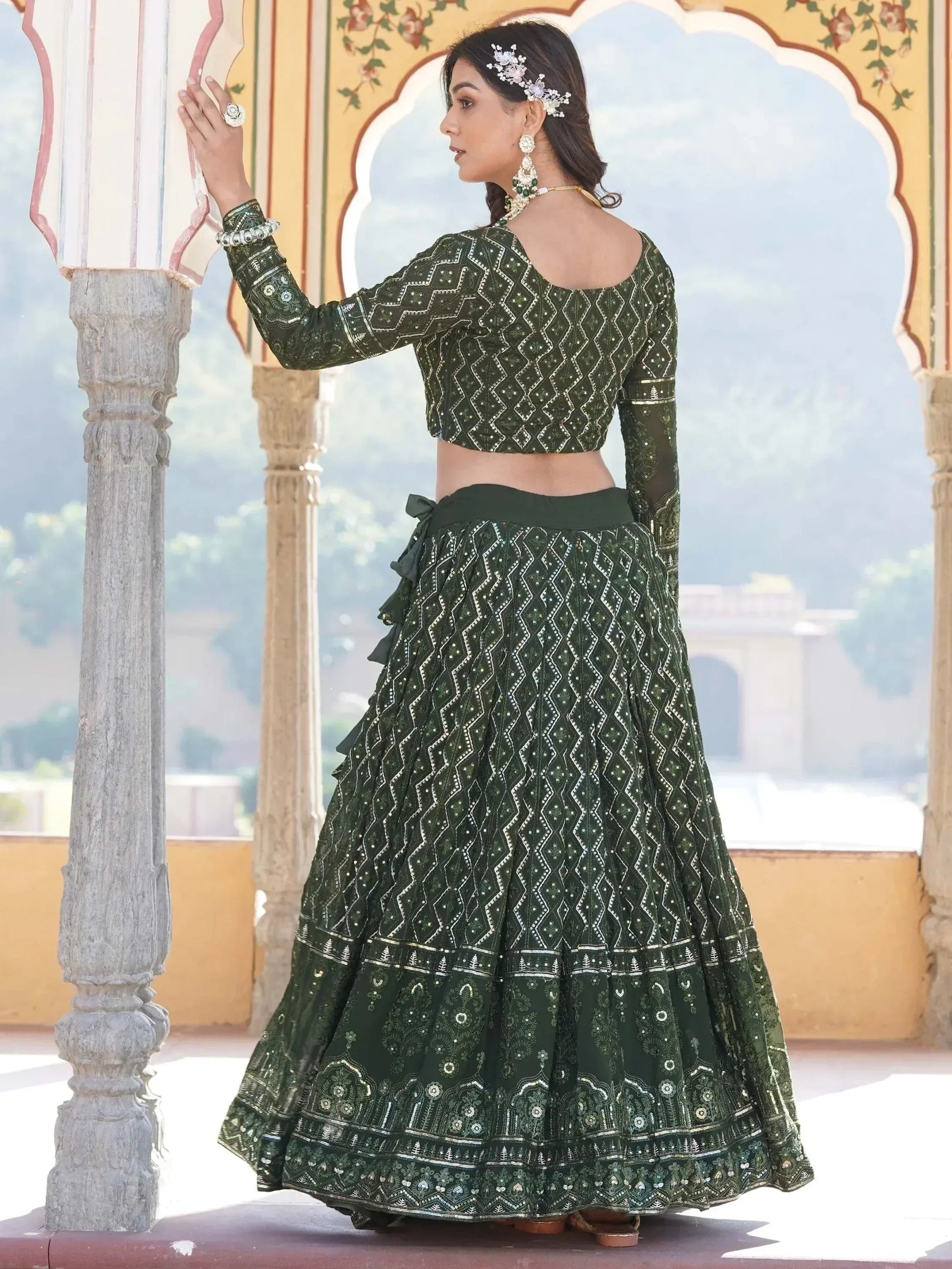 Emerald green embroidered lehenga choli with geometric patterns, perfect for Indian ethnic wear occasions
