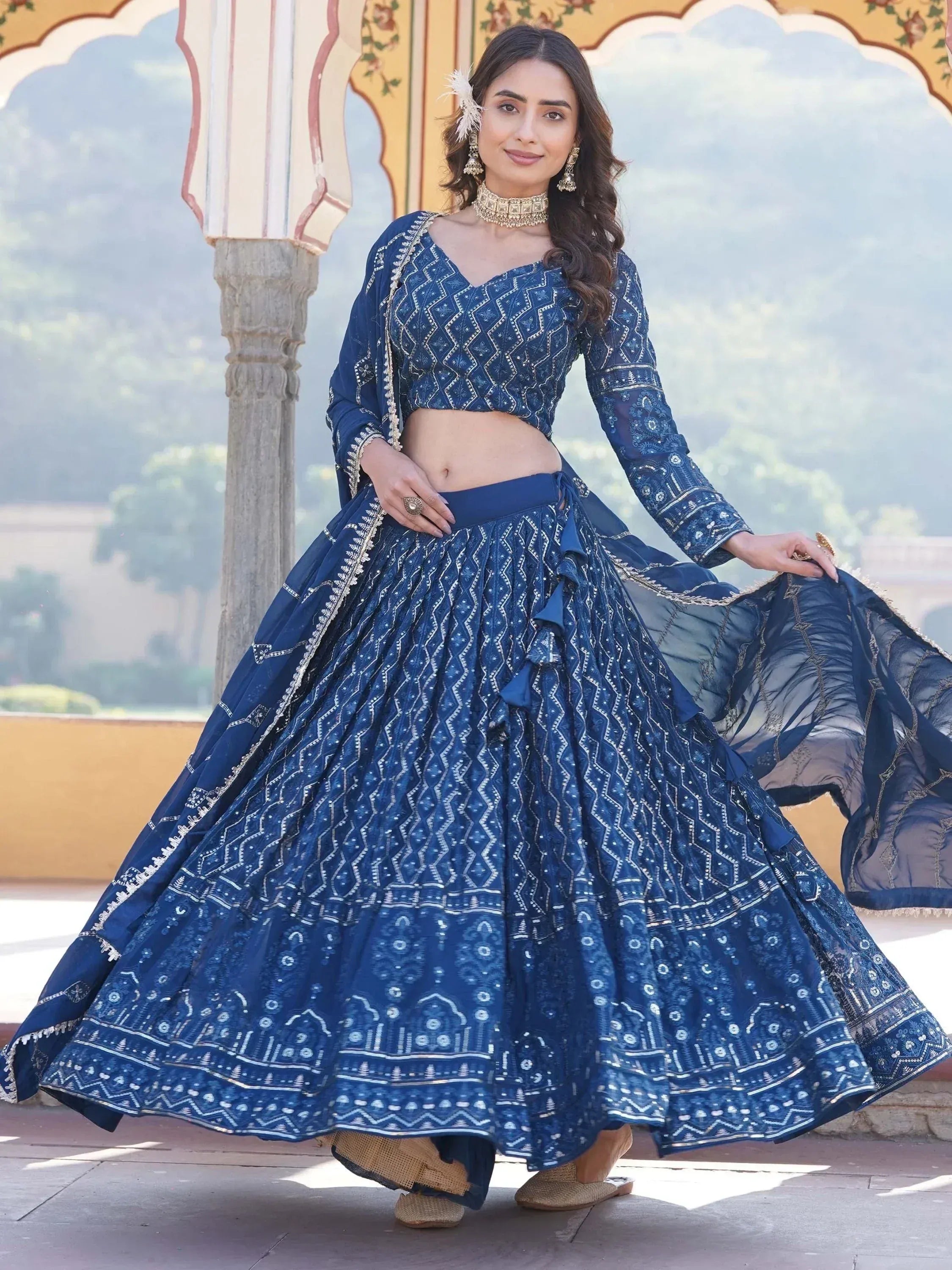 Blue embroidered lehenga choli with geometric patterns, perfect for Indian ethnic wear and festive occasions.