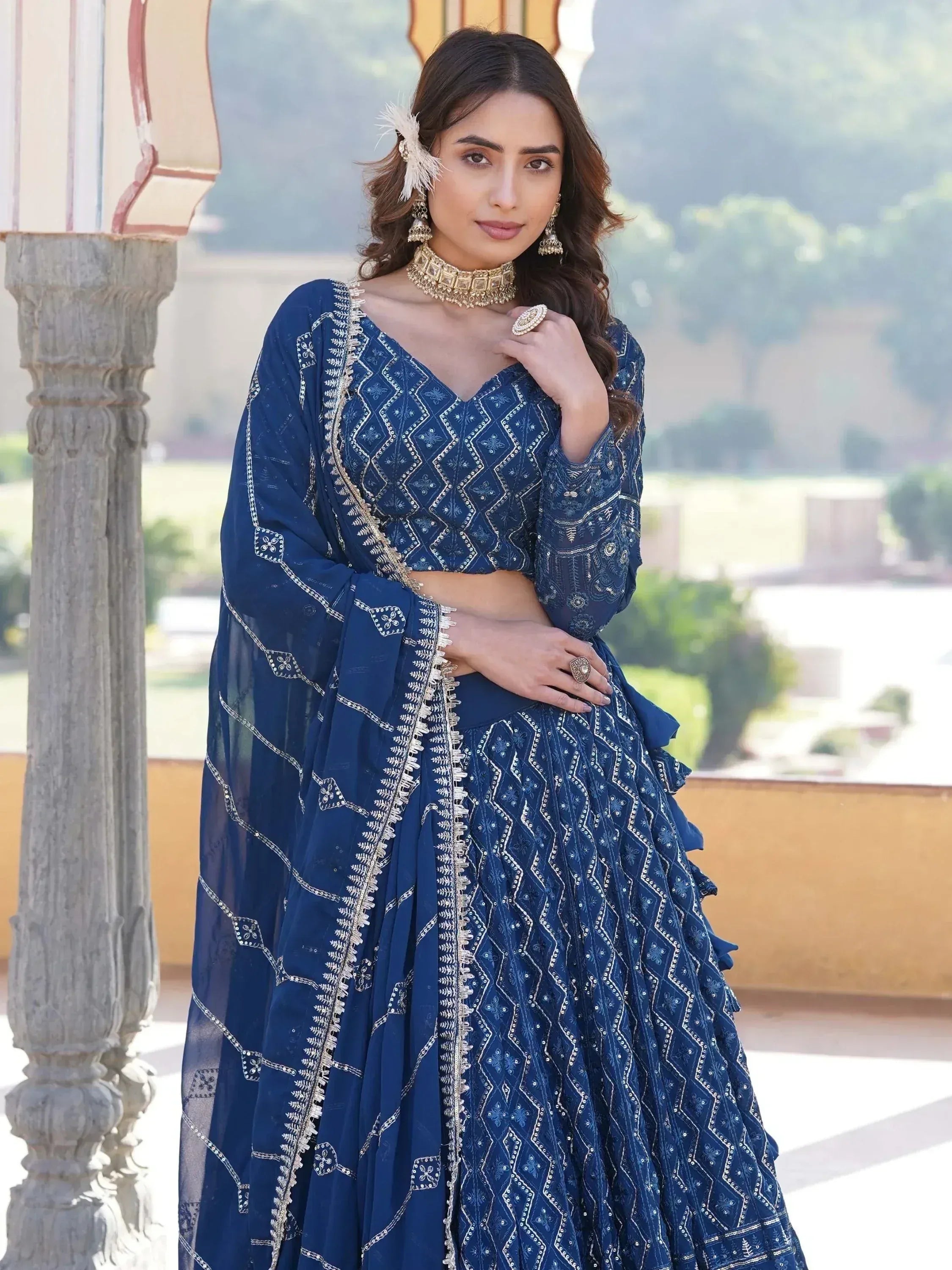Elegant blue embroidered lehenga choli with gold detailing, perfect for Indian ethnic occasions.