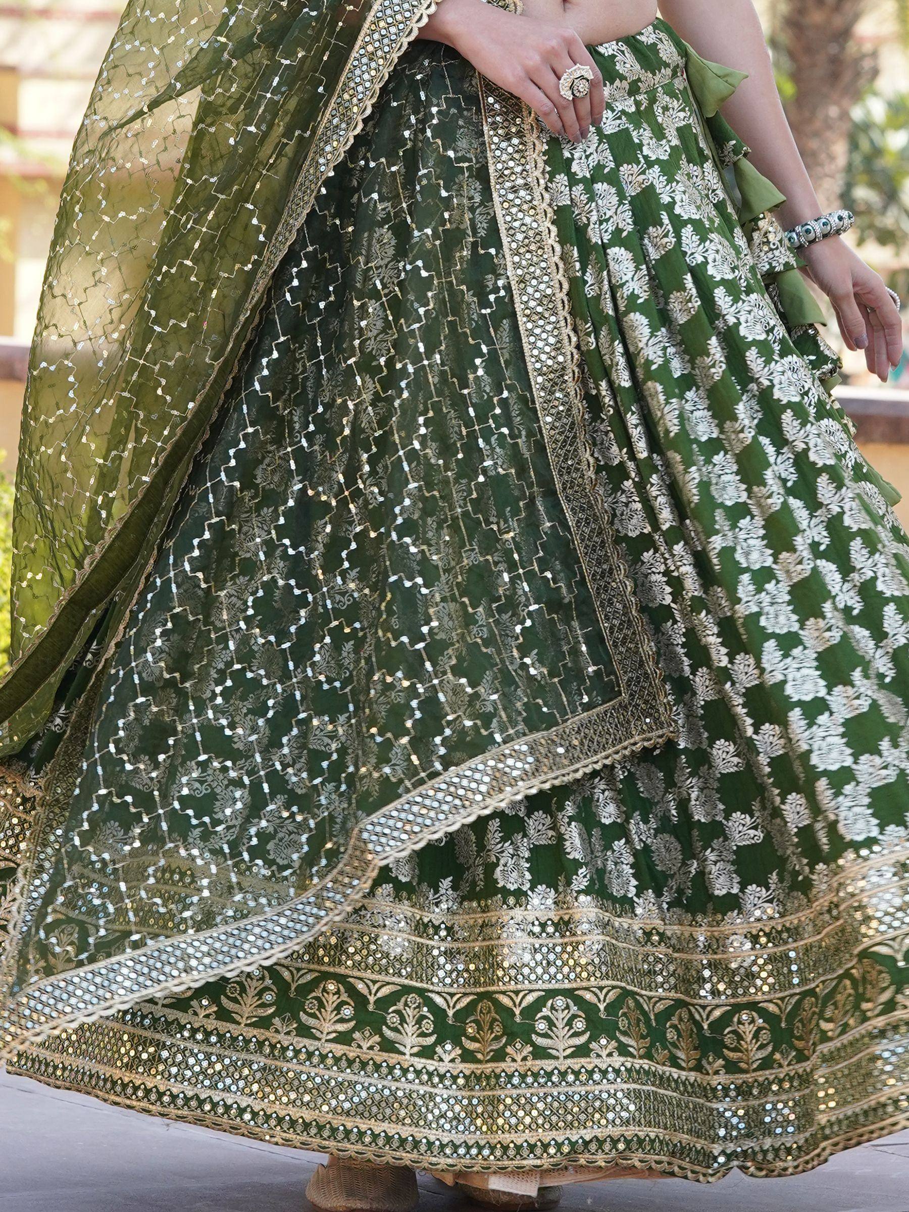 Green designer lehenga choli with gold embroidery and mirror work, ethnic Indian wear