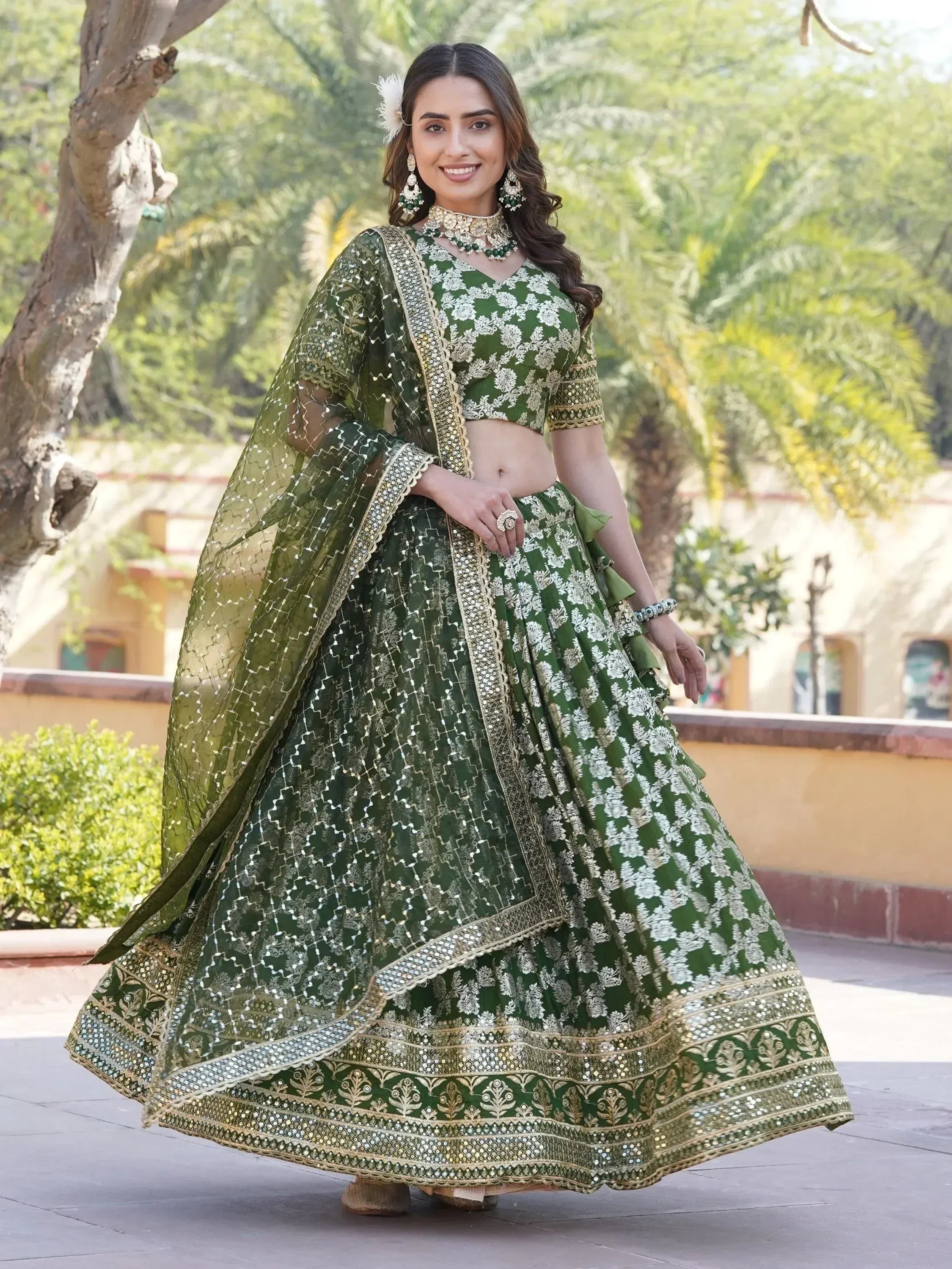 Green embroidered lehenga choli with gold detailing, perfect for Indian ethnic wear and festive occasions.