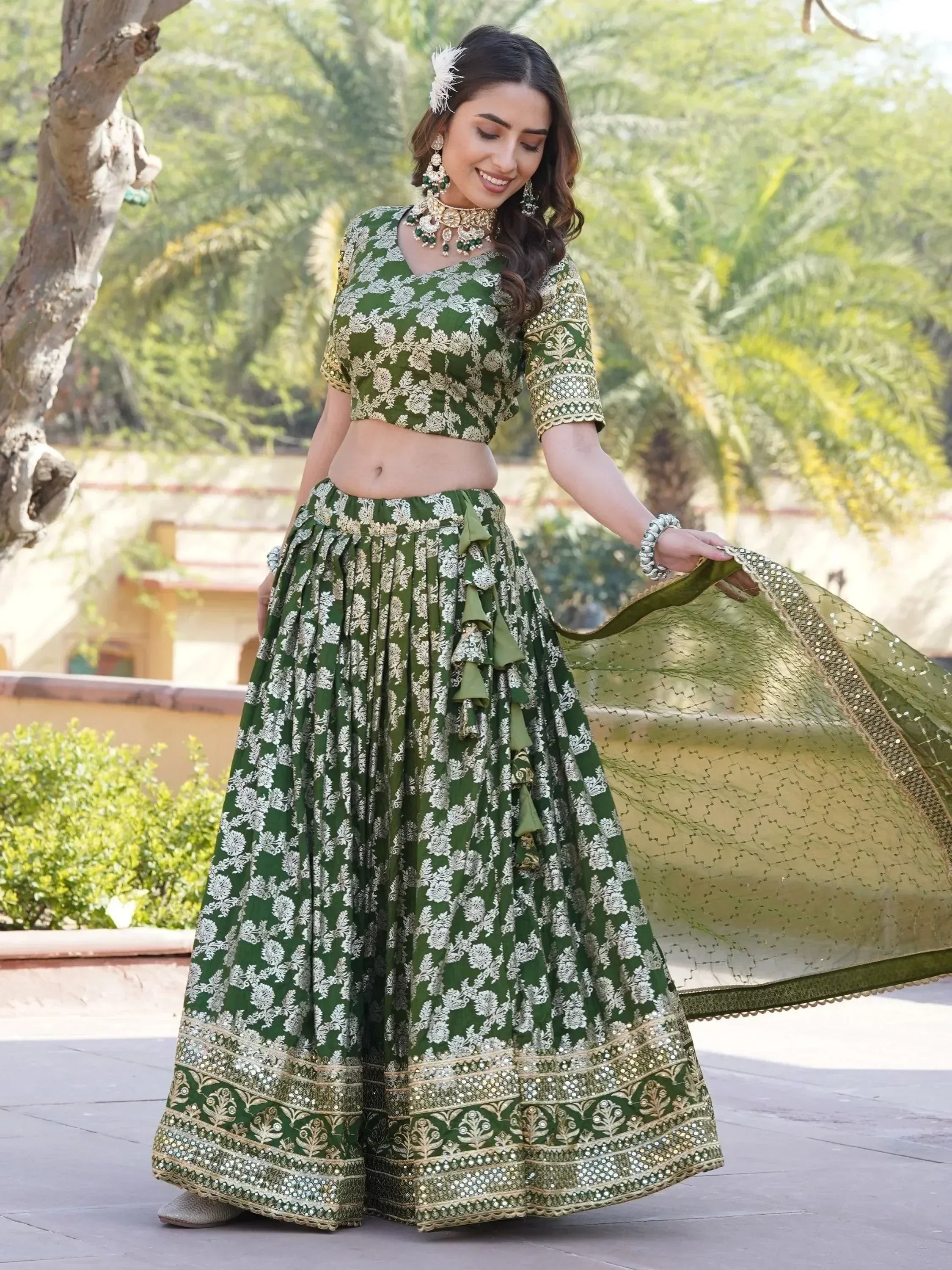 Green floral lehenga choli with gold embroidery, perfect for Indian weddings and festive occasions.