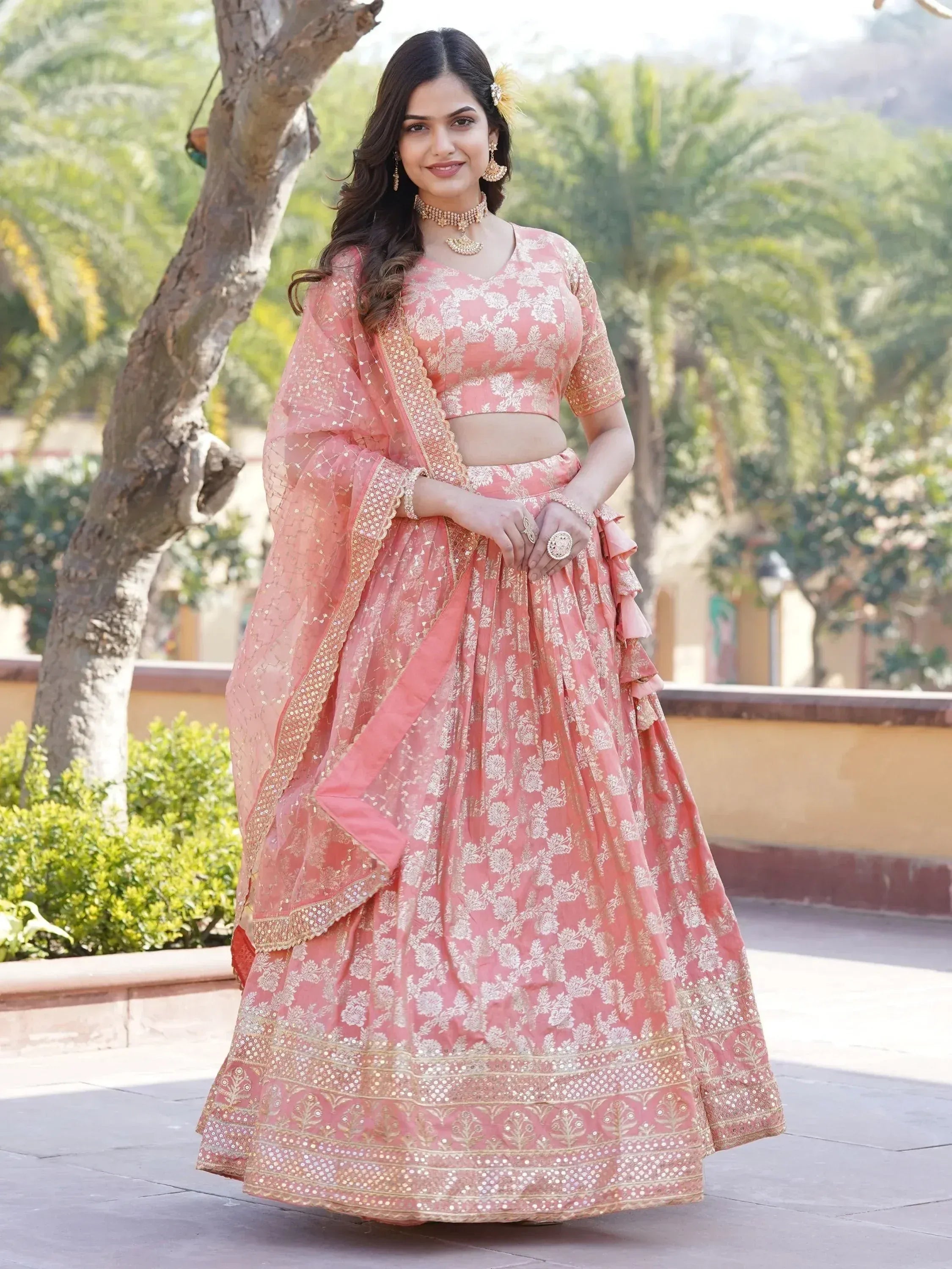 Pink floral lehenga choli with gold embroidery, perfect for Indian weddings and festive occasions