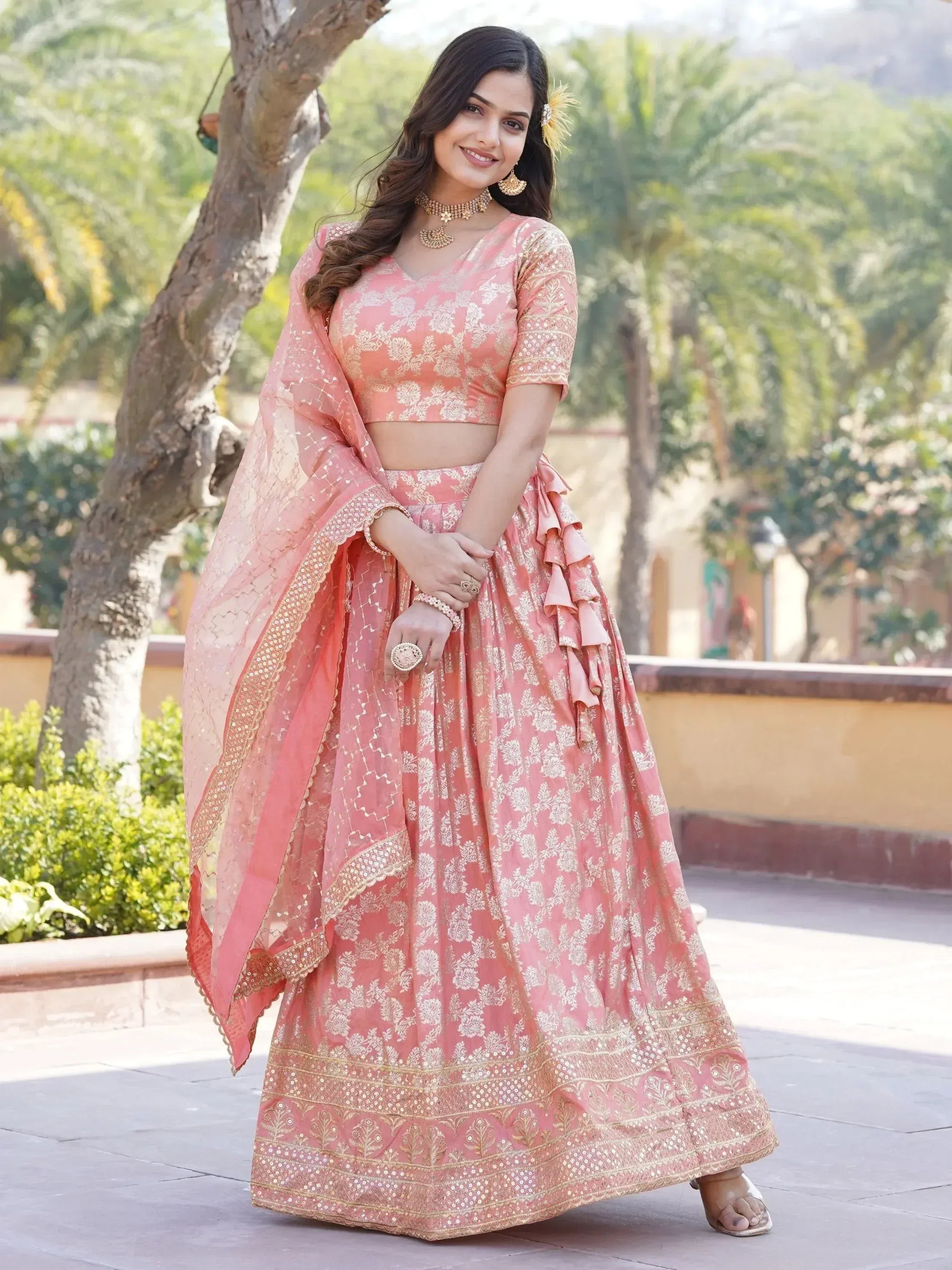 Pink floral lehenga choli with gold embroidery and ruffled skirt for Indian ethnic wear