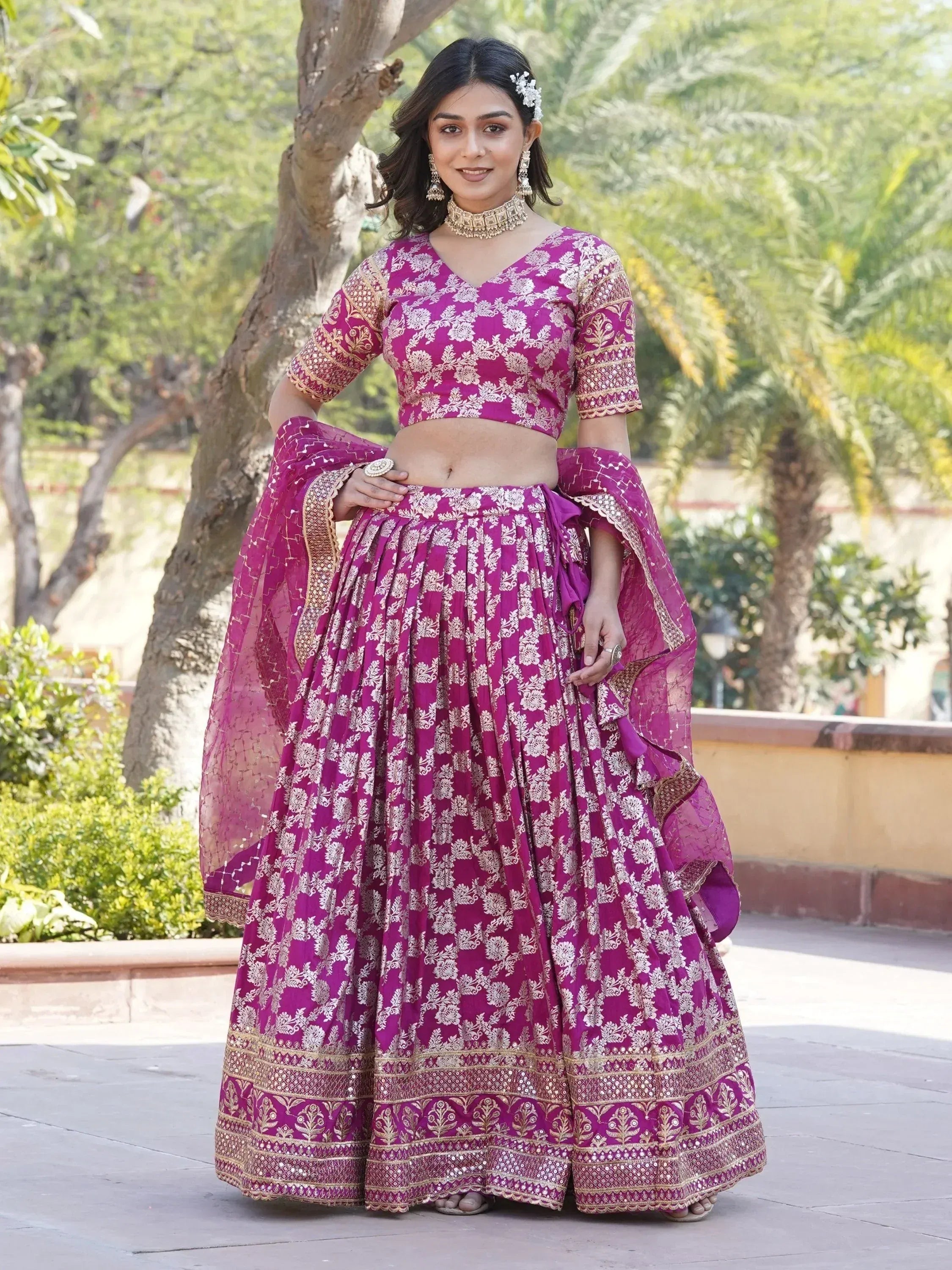 Purple floral lehenga choli with gold embroidery, perfect for Indian weddings and festive occasions