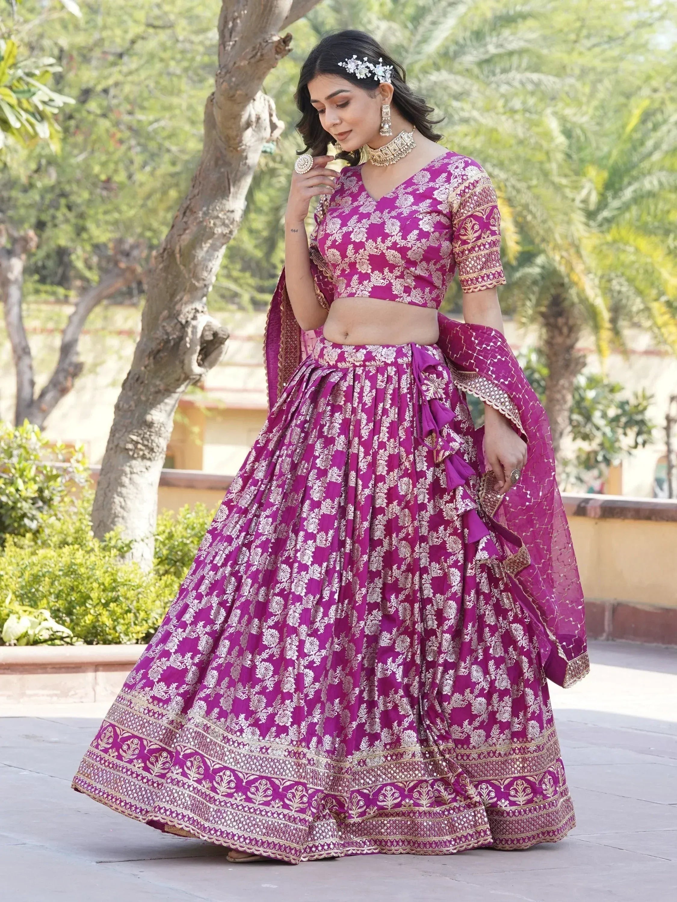 Purple floral lehenga choli with gold embroidery, perfect for Indian weddings and festive occasions