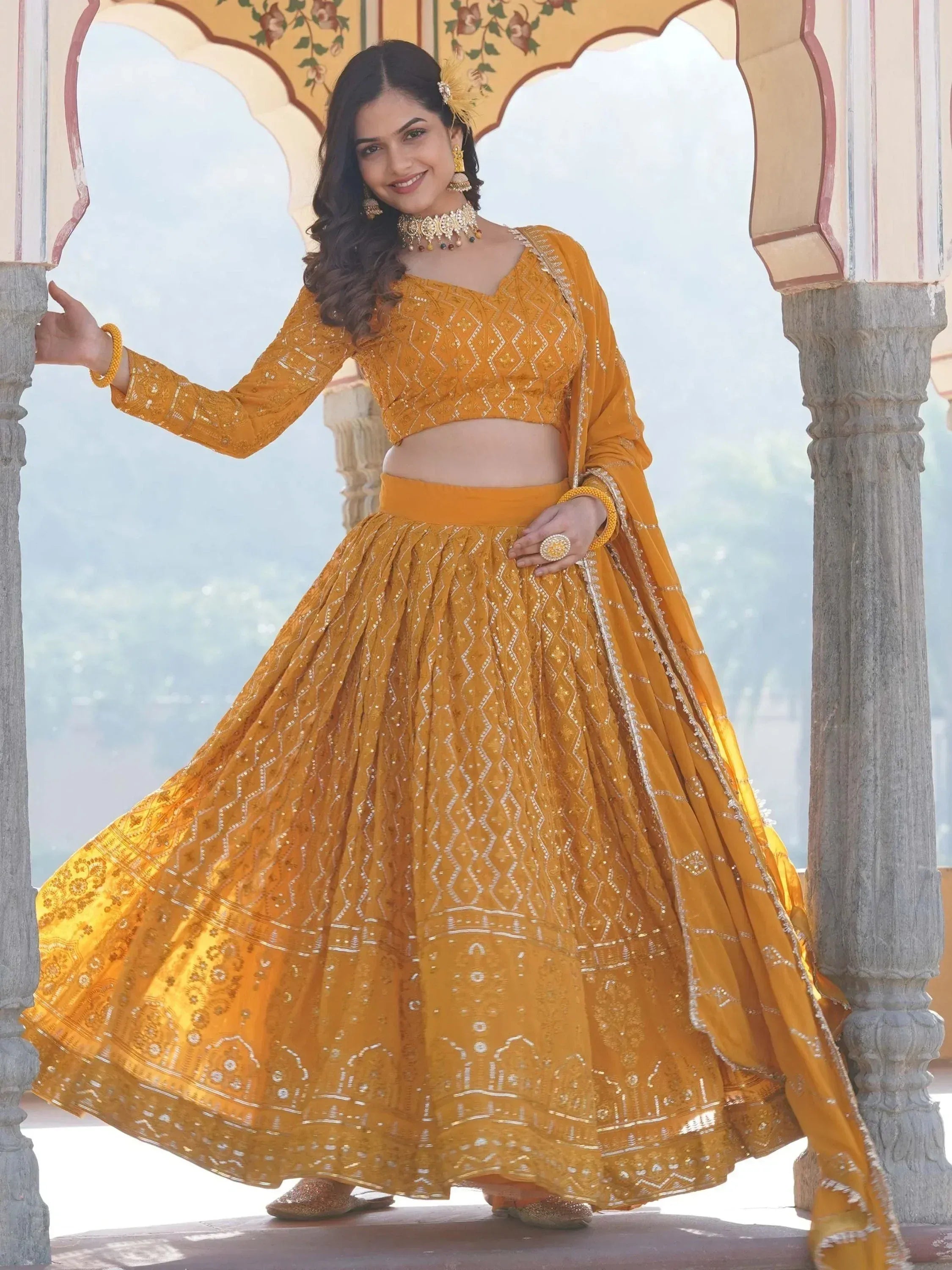 Mustard yellow embroidered lehenga choli with dupatta, traditional Indian ethnic wear for women