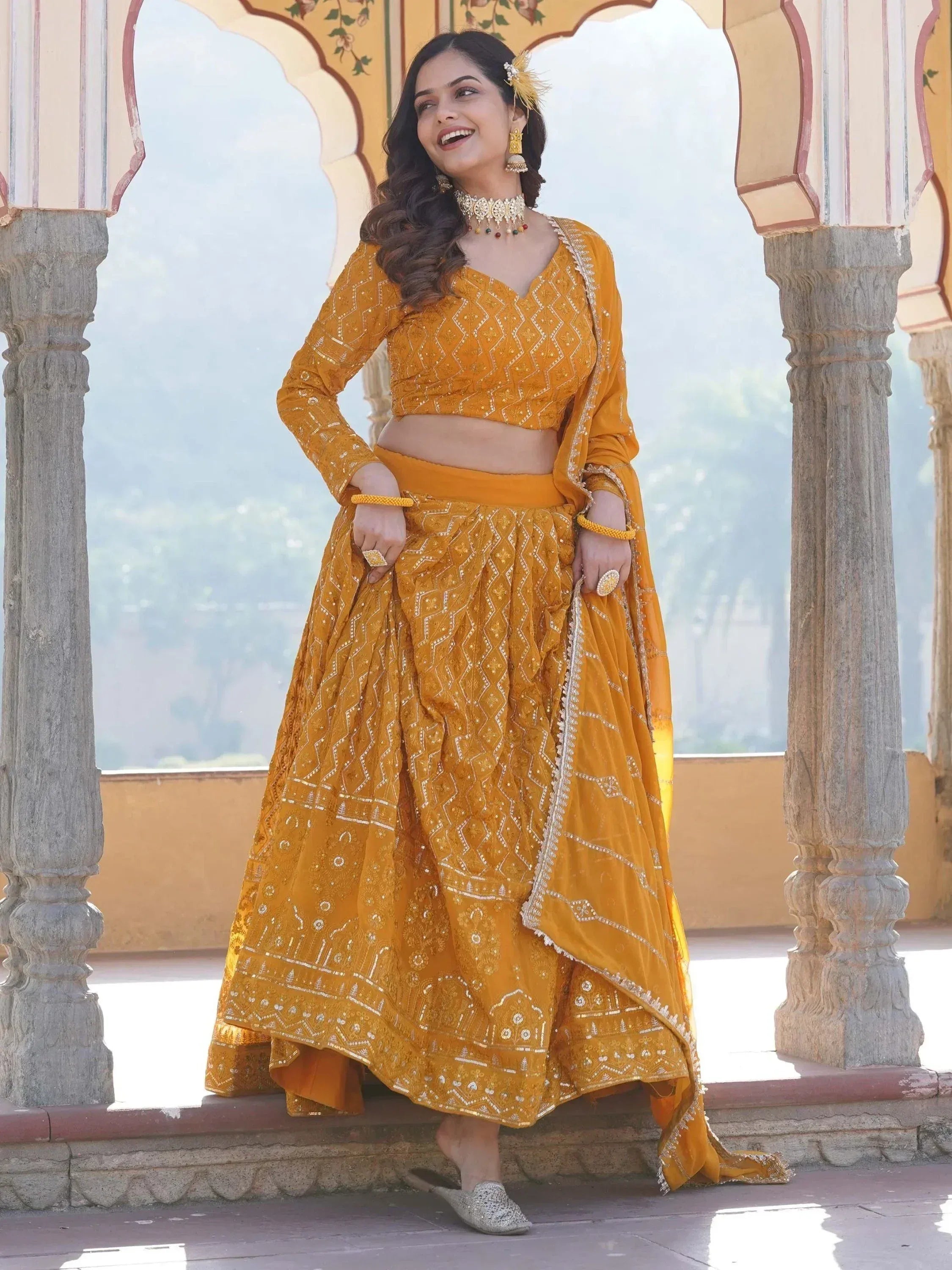 Yellow embroidered lehenga choli with dupatta, traditional Indian ethnic wear for women