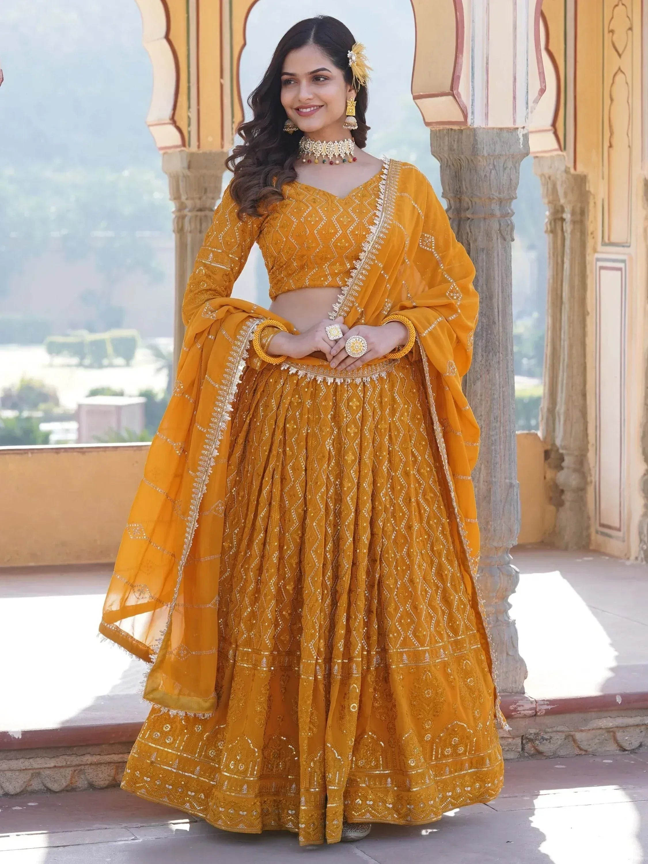 Mustard yellow embroidered lehenga choli with dupatta, traditional Indian ethnic wear for weddings and festivals