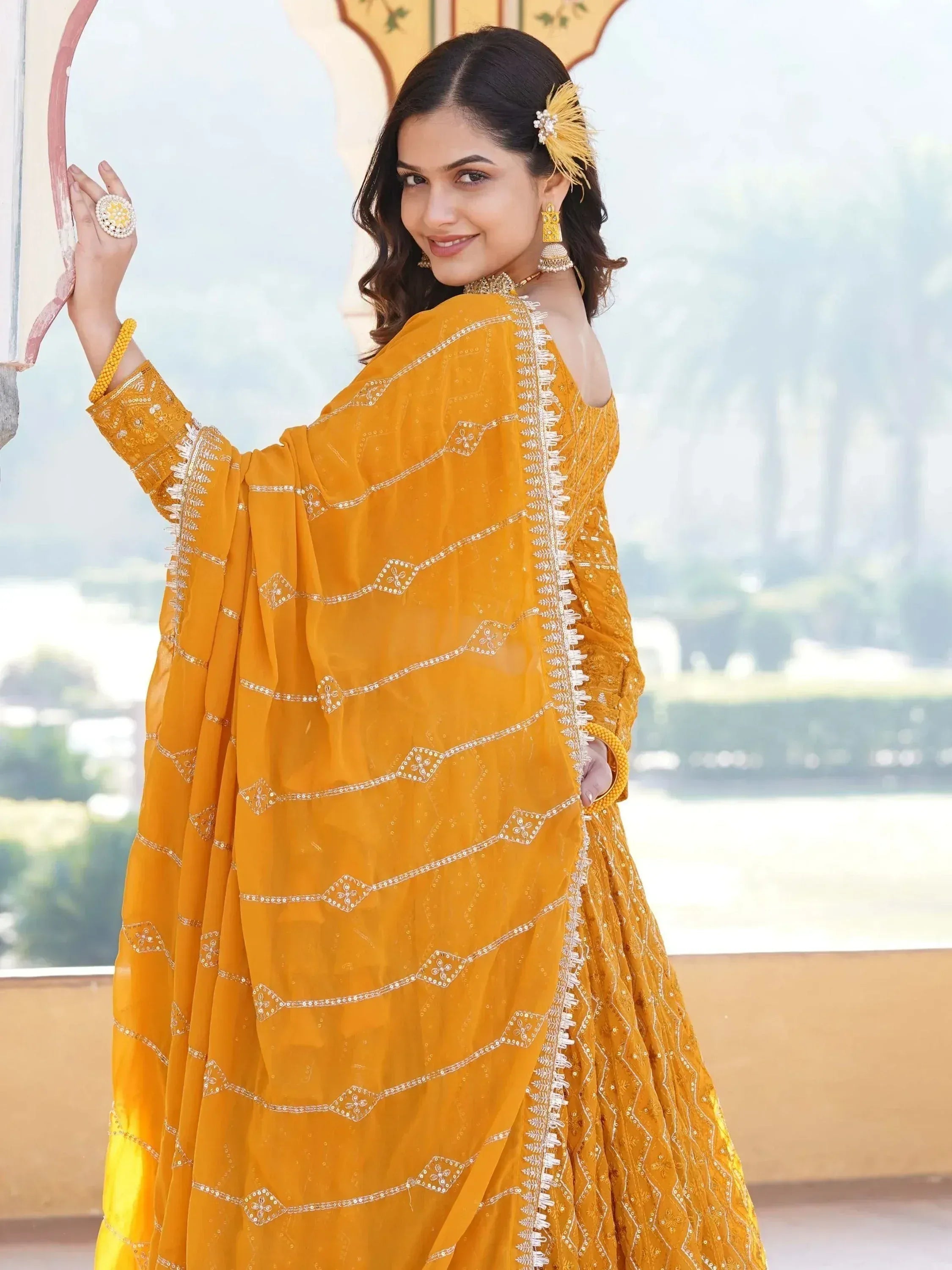 Yellow embroidered lehenga choli with mirror work, perfect for Indian ethnic wear and festive occasions