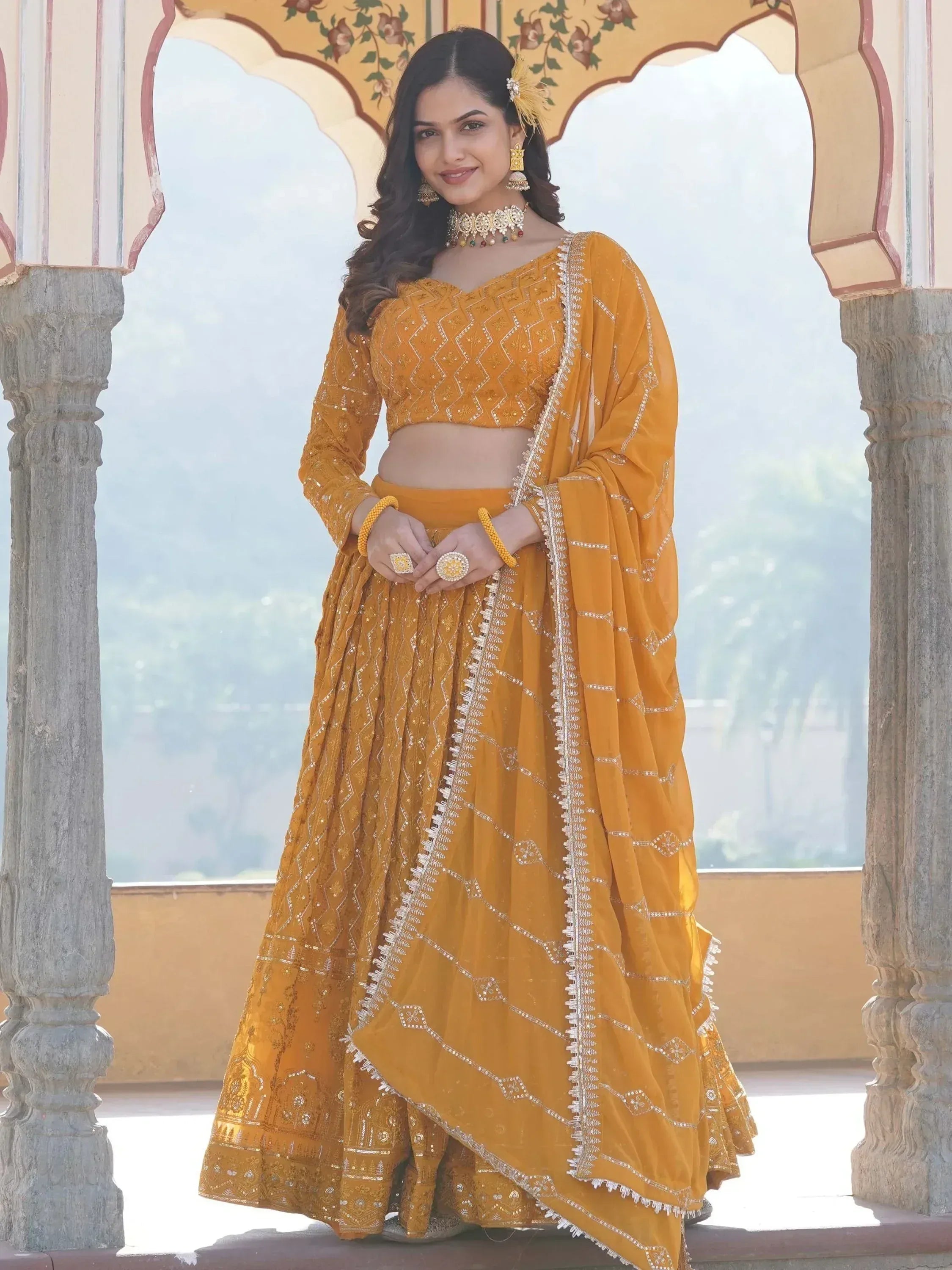 Mustard yellow embroidered lehenga choli with dupatta, traditional Indian ethnic wear for weddings and festivals