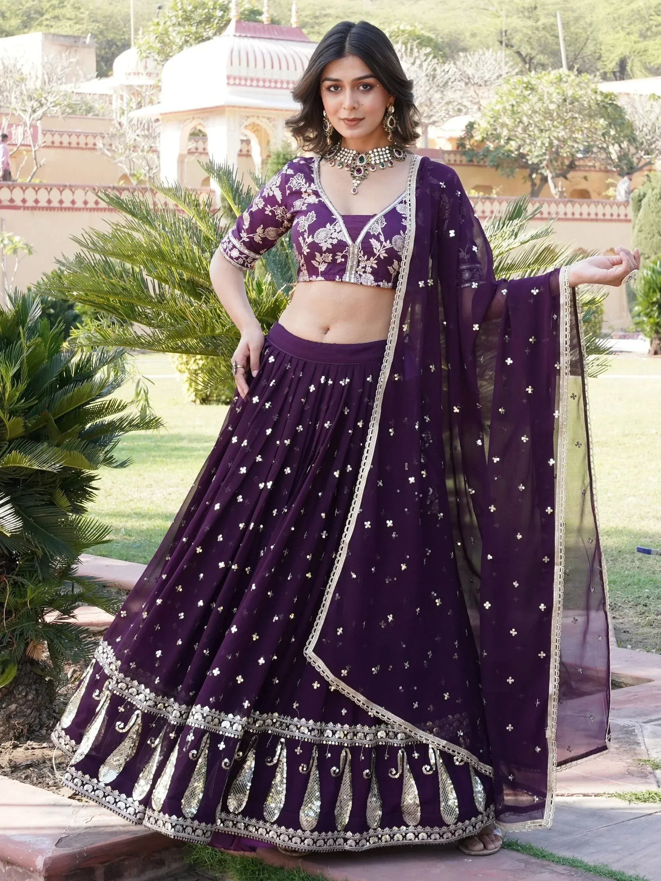 Purple embroidered lehenga choli with gold detailing, perfect for Indian ethnic wear and festive occasions.