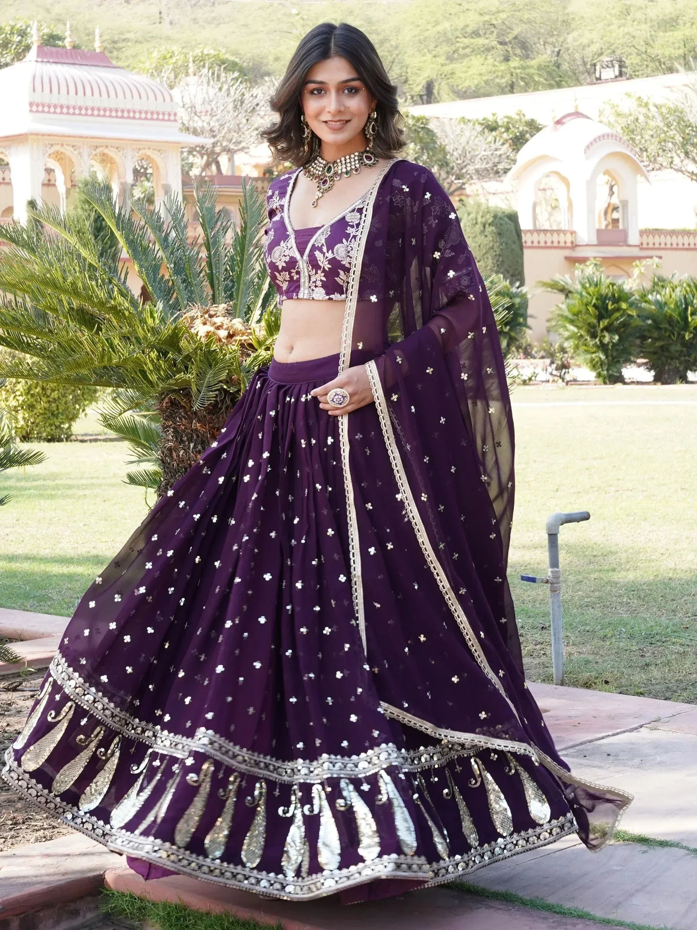 Elegant purple lehenga choli with gold embroidery, perfect for Indian ethnic wear occasions.