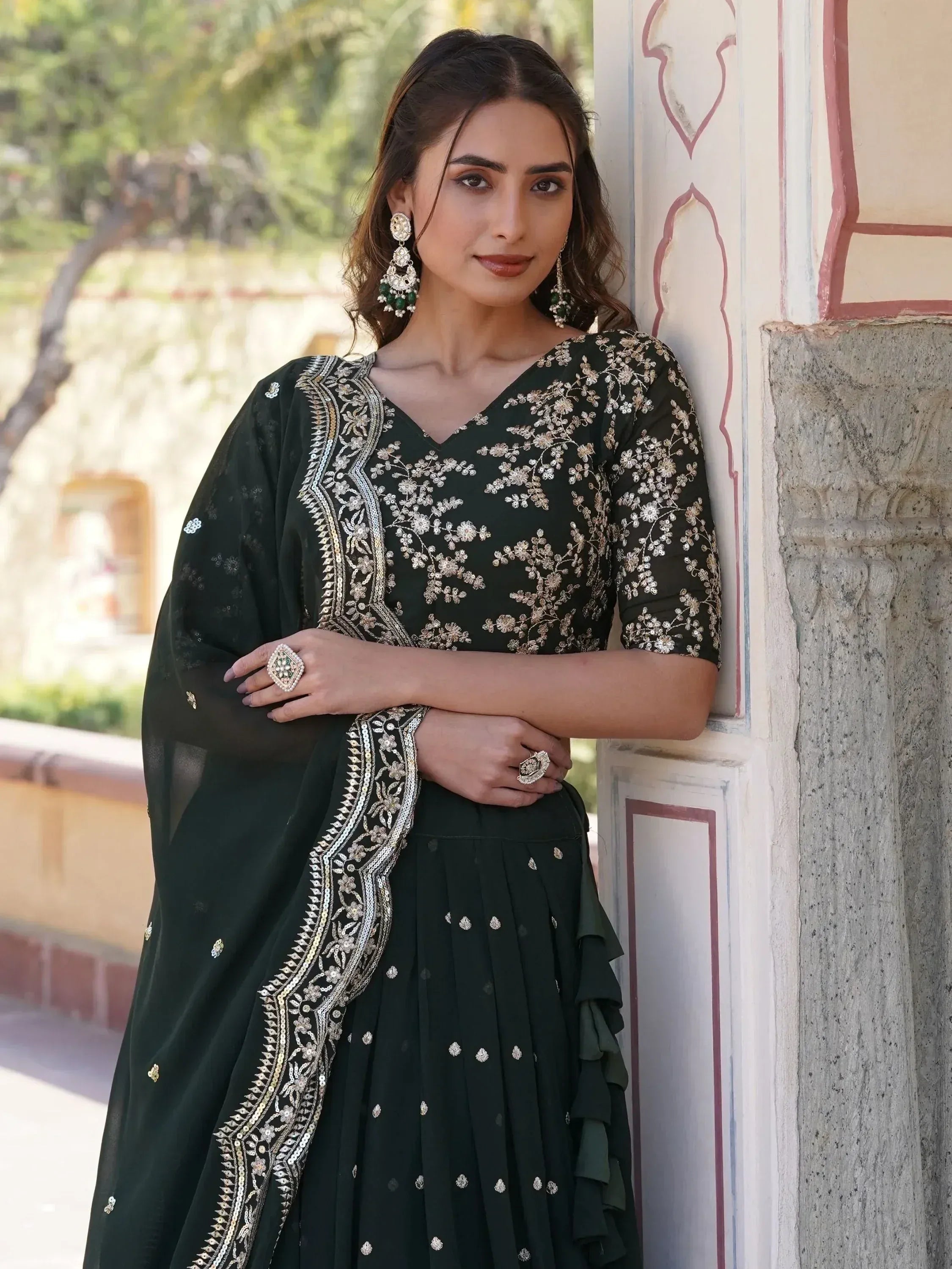 Elegant dark green embroidered salwar kameez with gold floral work, perfect for Indian ethnic wear occasions.