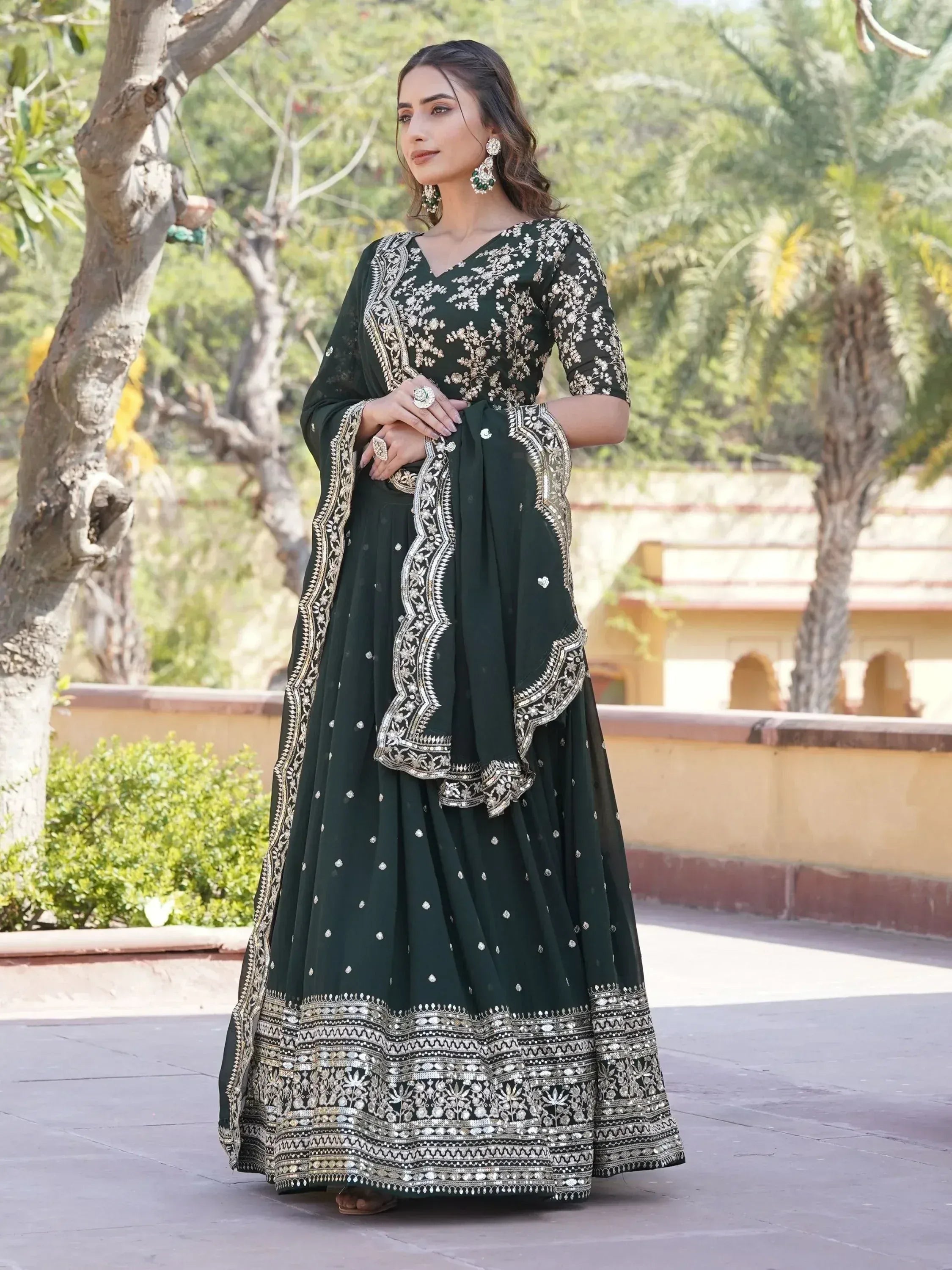 Emerald green embroidered anarkali suit with gold detailing, perfect for Indian ethnic wear occasions
