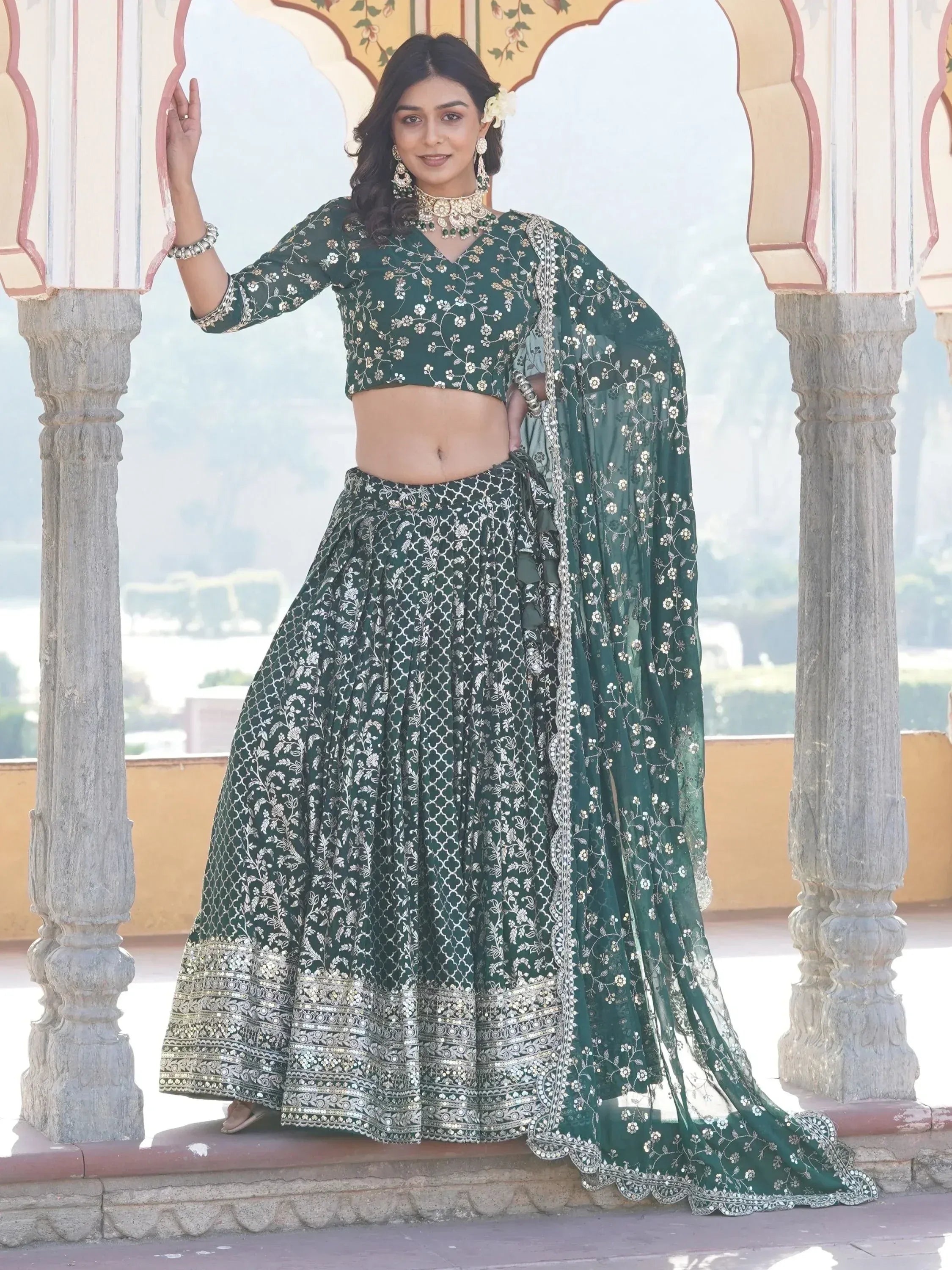 Emerald green embroidered lehenga choli with floral motifs, perfect for Indian ethnic wear and festive occasions.