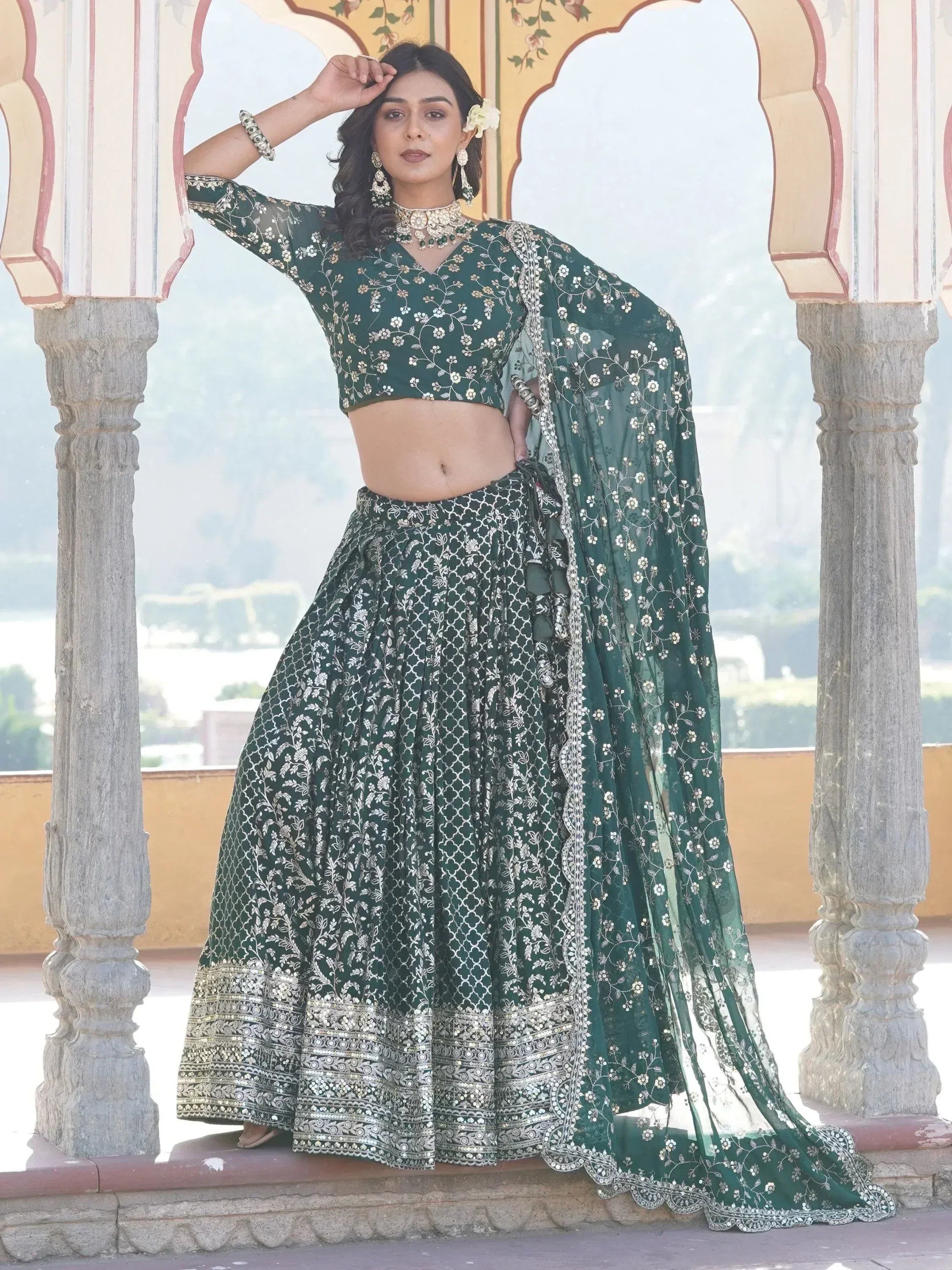 Emerald green embroidered lehenga choli with floral motifs, perfect for Indian ethnic wear events