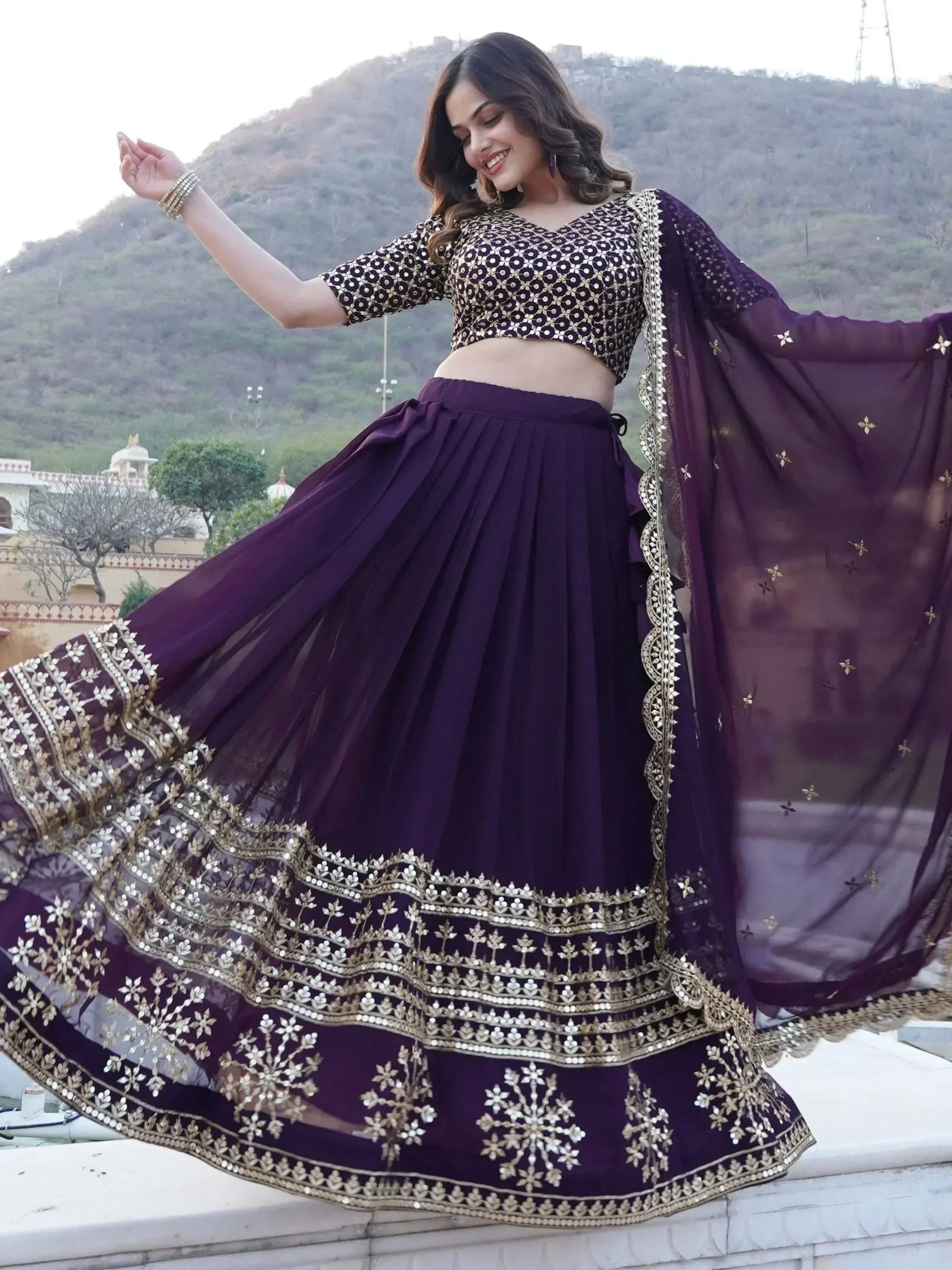 Elegant purple lehenga choli with gold embroidery, perfect for Indian ethnic wear and festive occasions.