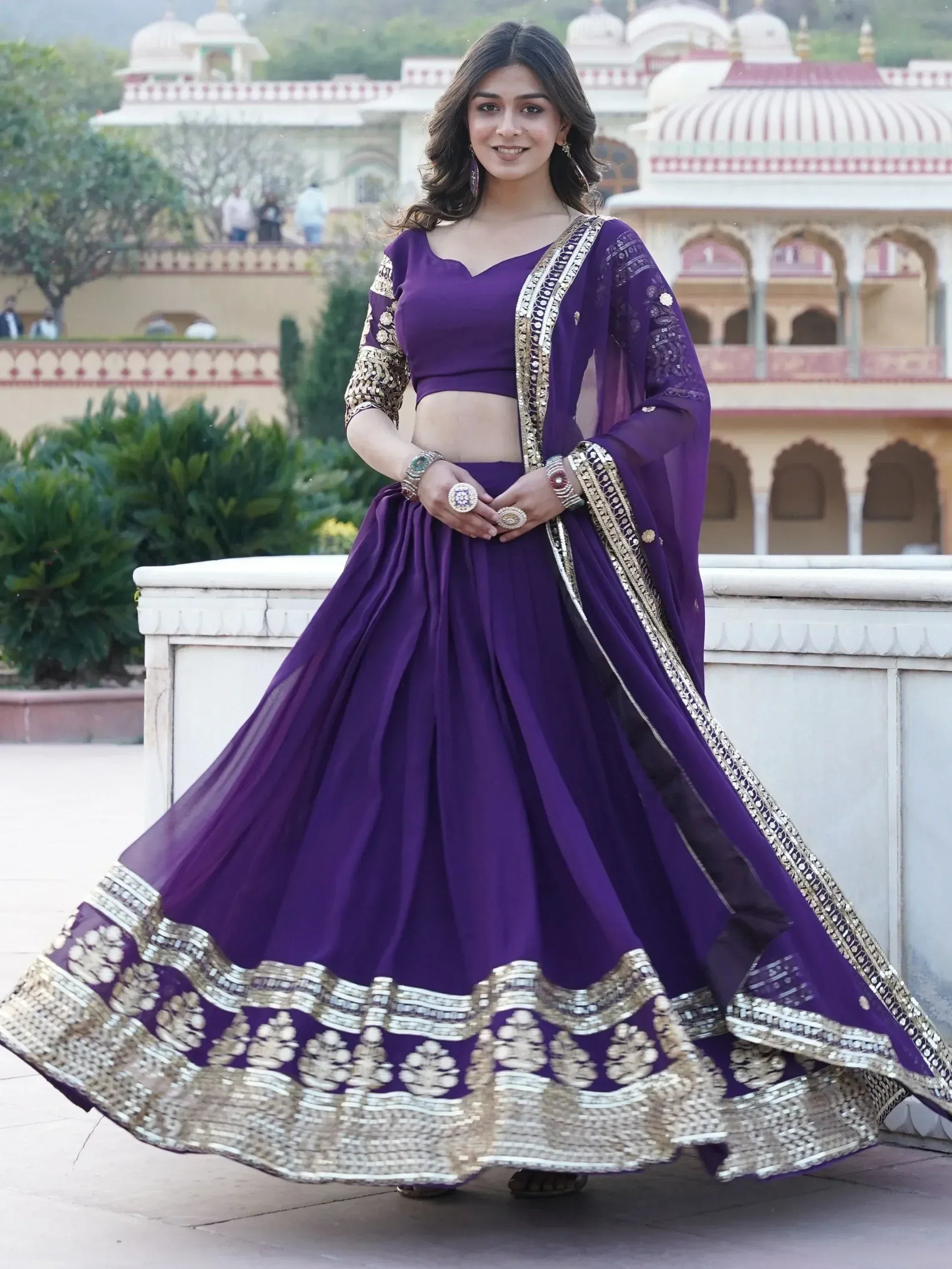Purple designer lehenga choli with gold embroidery, perfect for Indian ethnic wear and festive occasions.