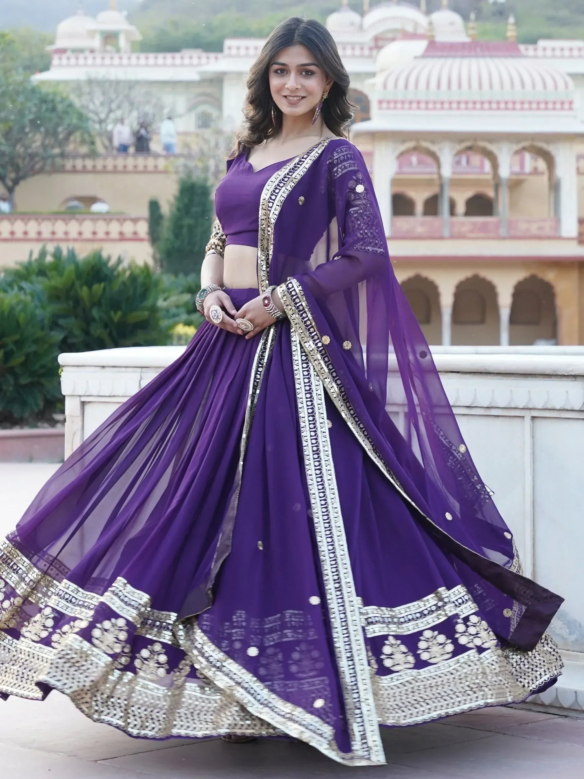 Purple designer lehenga choli with gold embroidery, perfect for Indian ethnic wear and festive occasions.