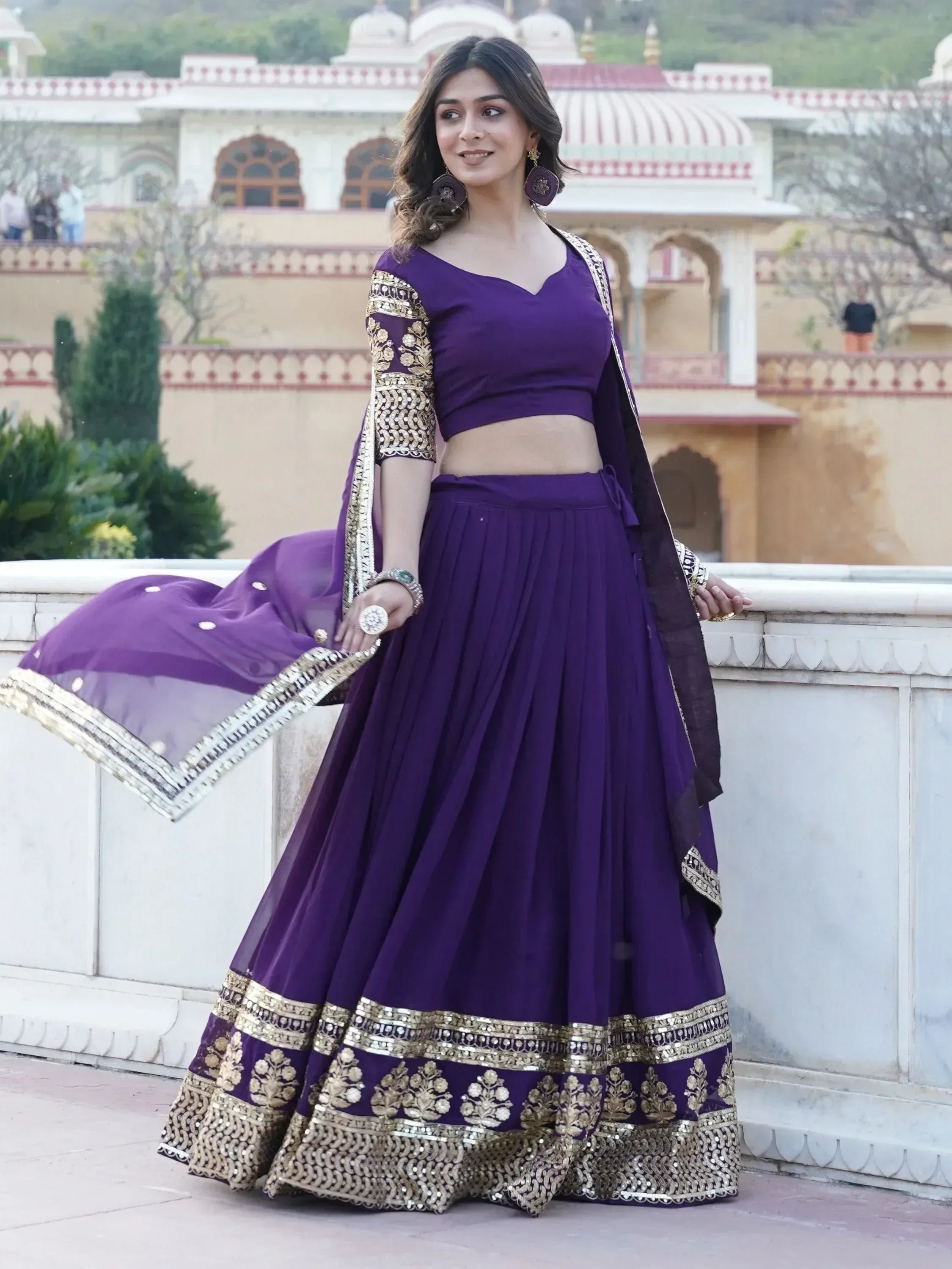 Purple designer lehenga choli with gold embroidery, perfect for Indian ethnic wear events
