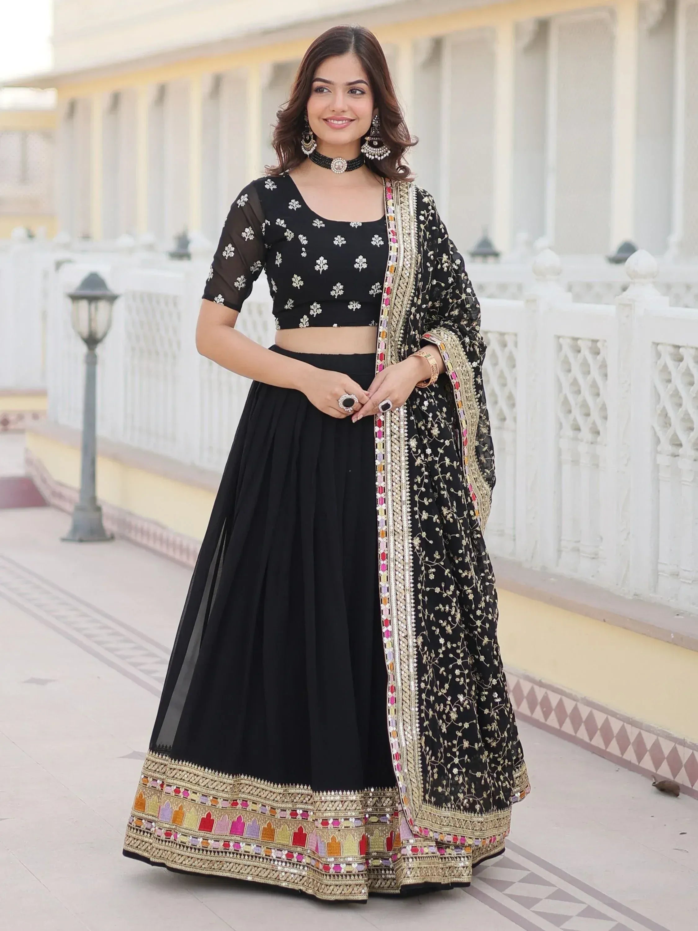 Black embroidered lehenga choli with colorful border, perfect for Indian ethnic wear occasions