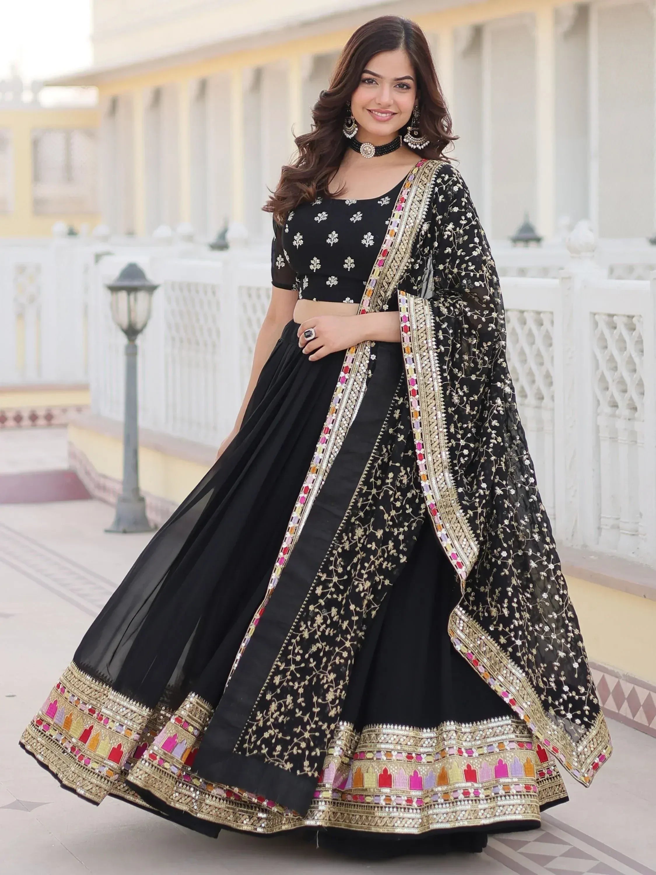 Black embroidered lehenga choli with colorful border, perfect for Indian ethnic wear occasions
