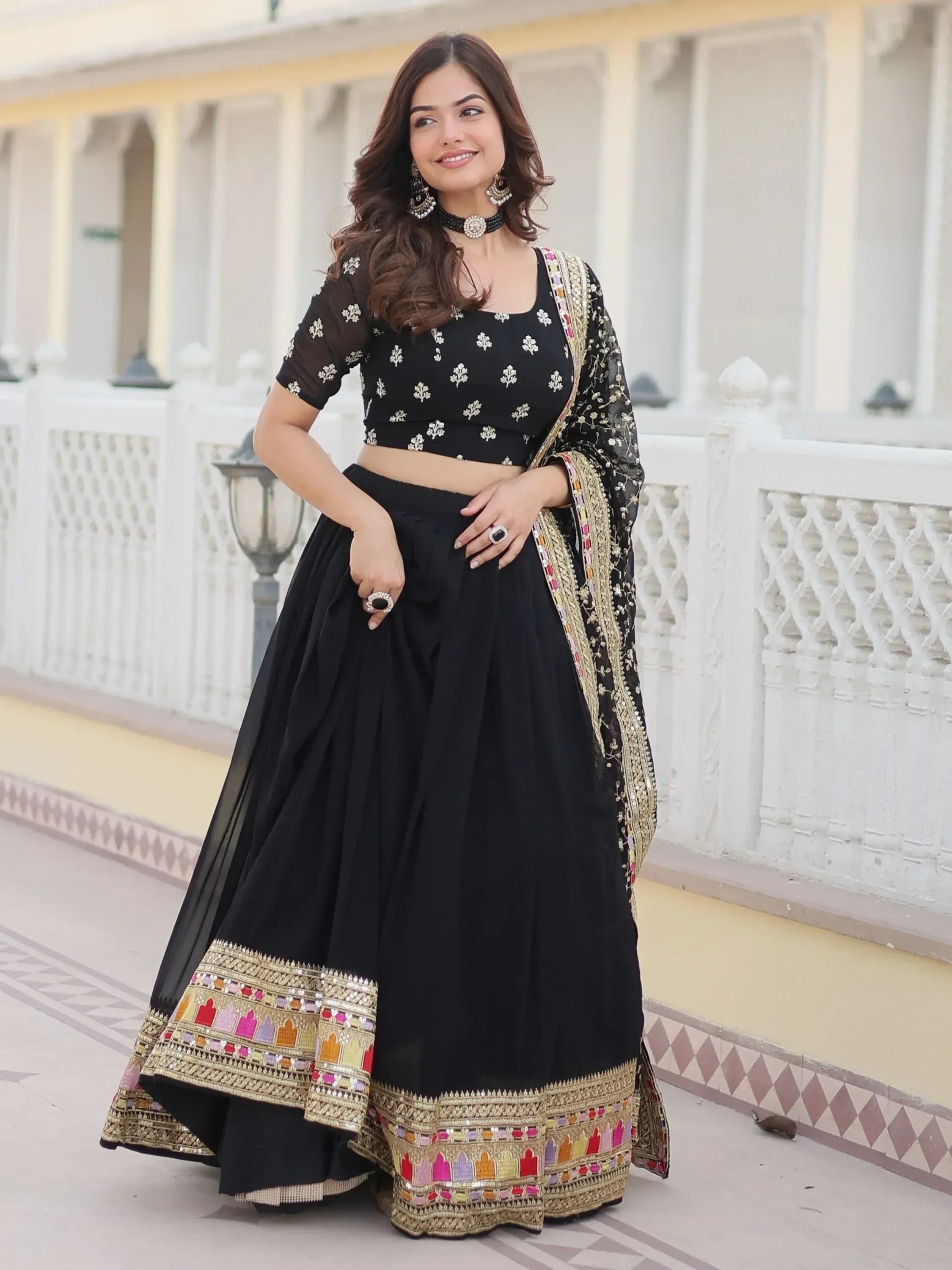 Black embroidered lehenga choli with colorful border, perfect for Indian ethnic wear occasions