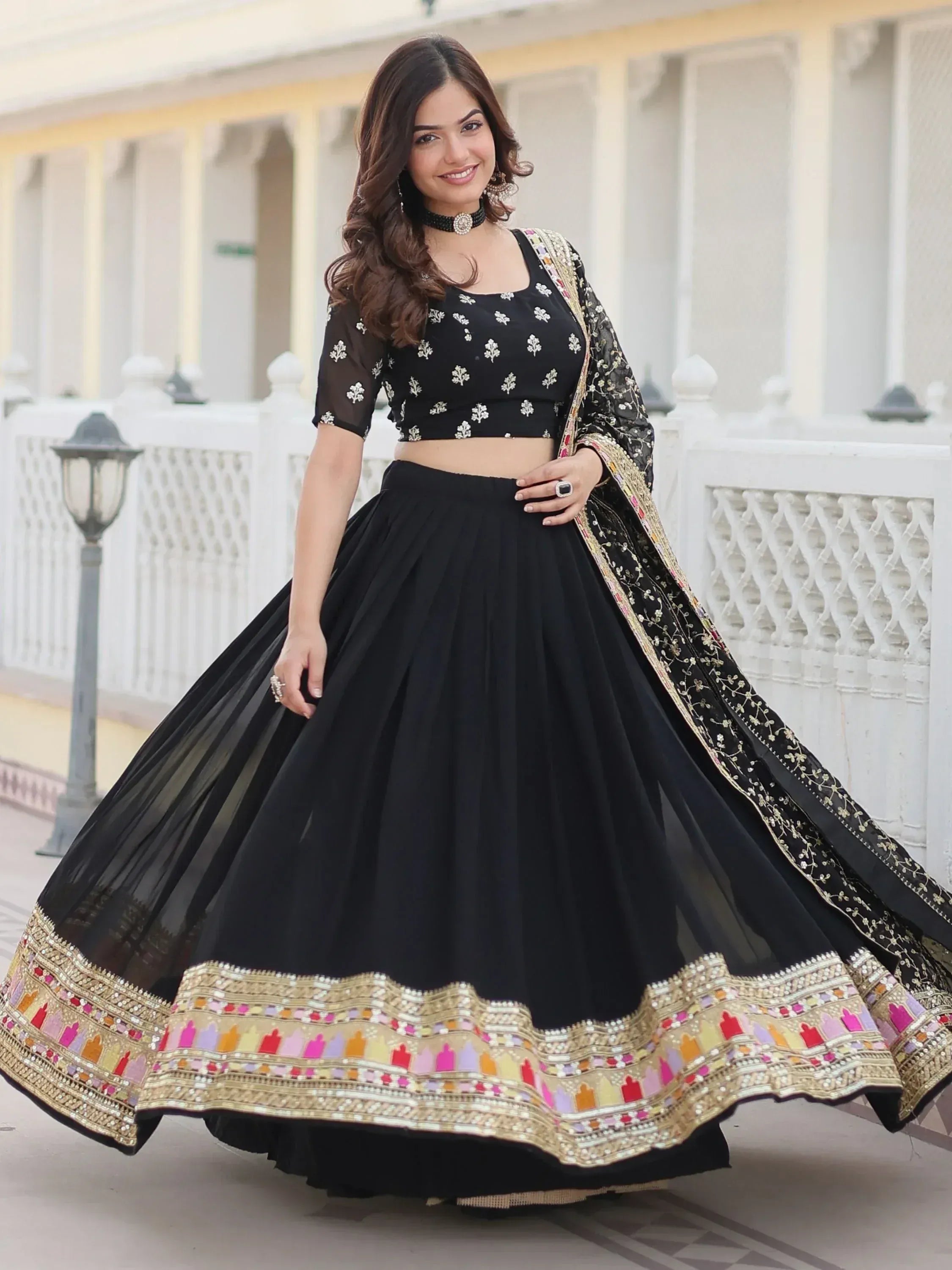 Black embroidered lehenga choli with colorful border, perfect for Indian ethnic wear occasions