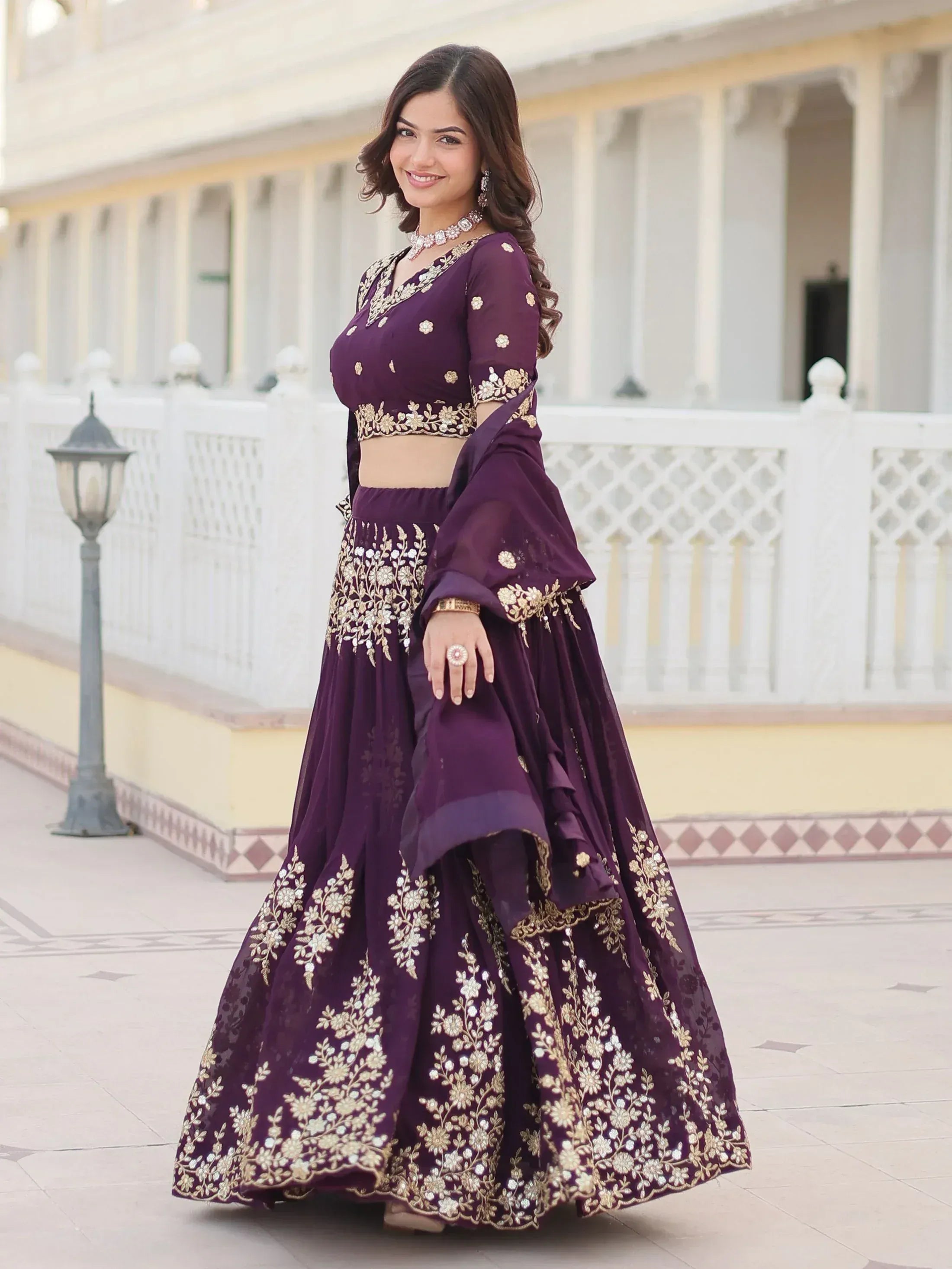 Purple embroidered lehenga choli with gold floral work, perfect for Indian ethnic wear occasions