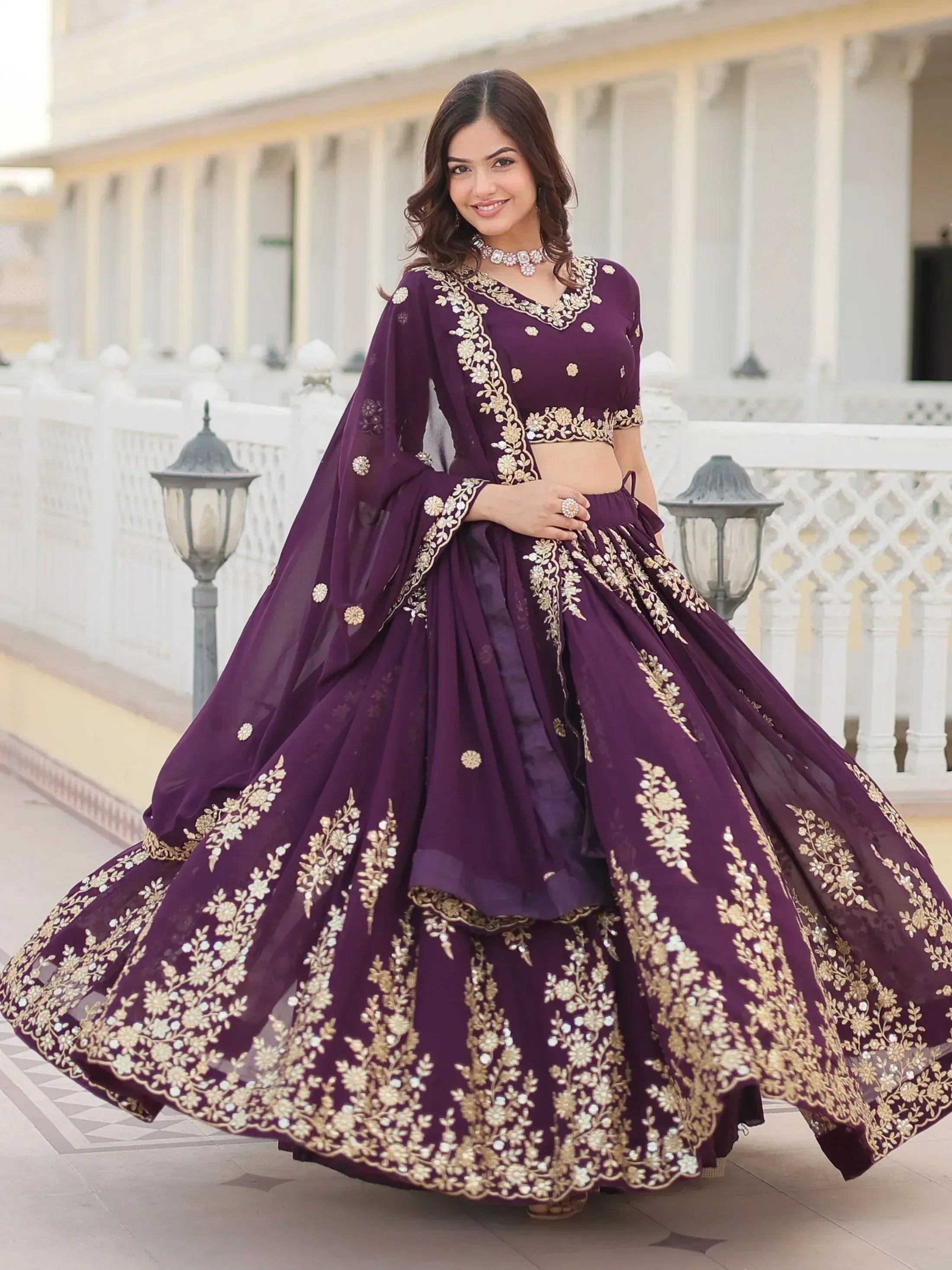 Elegant purple lehenga choli with gold embroidery, perfect for Indian ethnic wear occasions.
