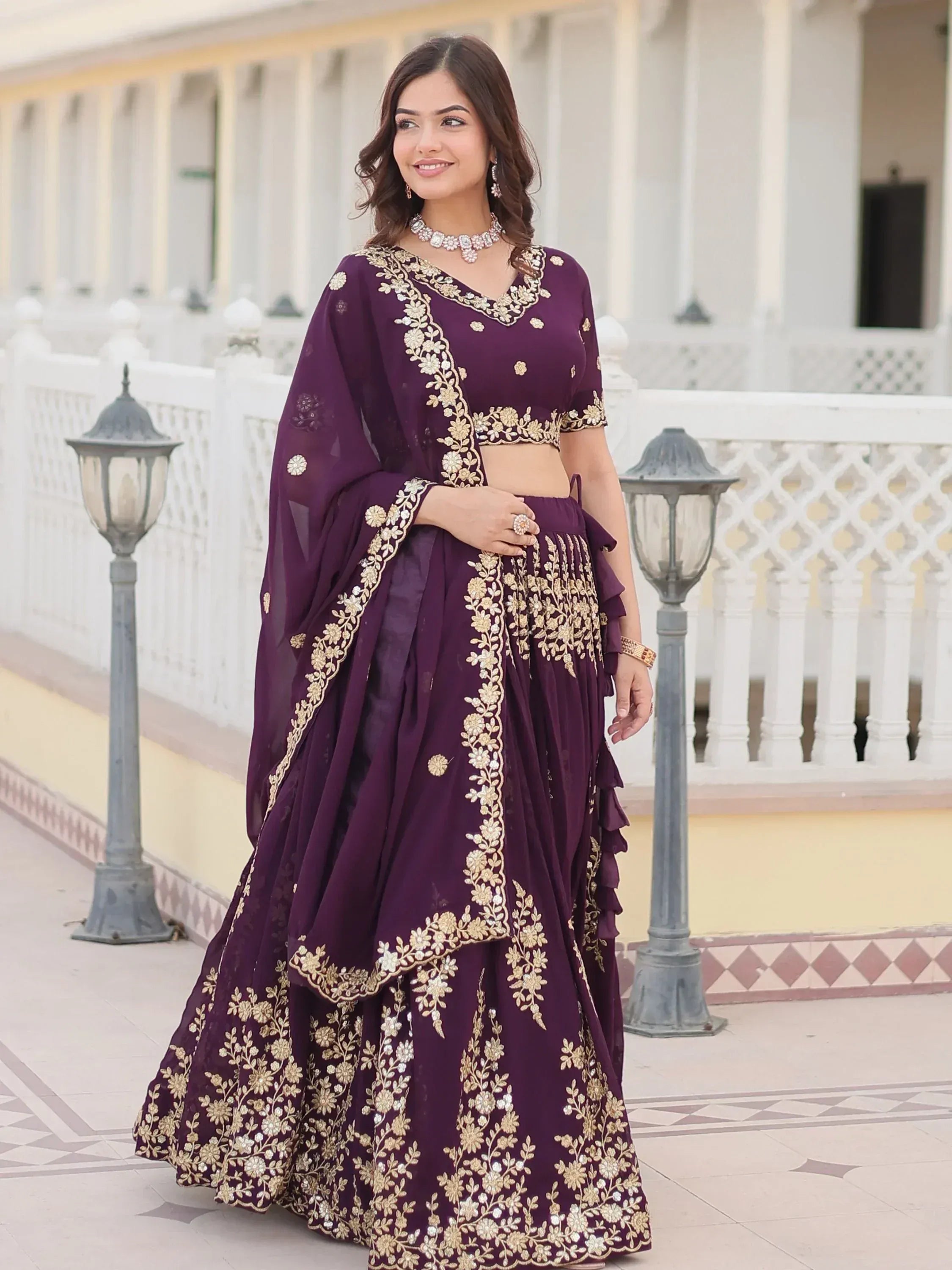 Purple designer lehenga choli with gold floral embroidery, perfect for Indian ethnic wear occasions.