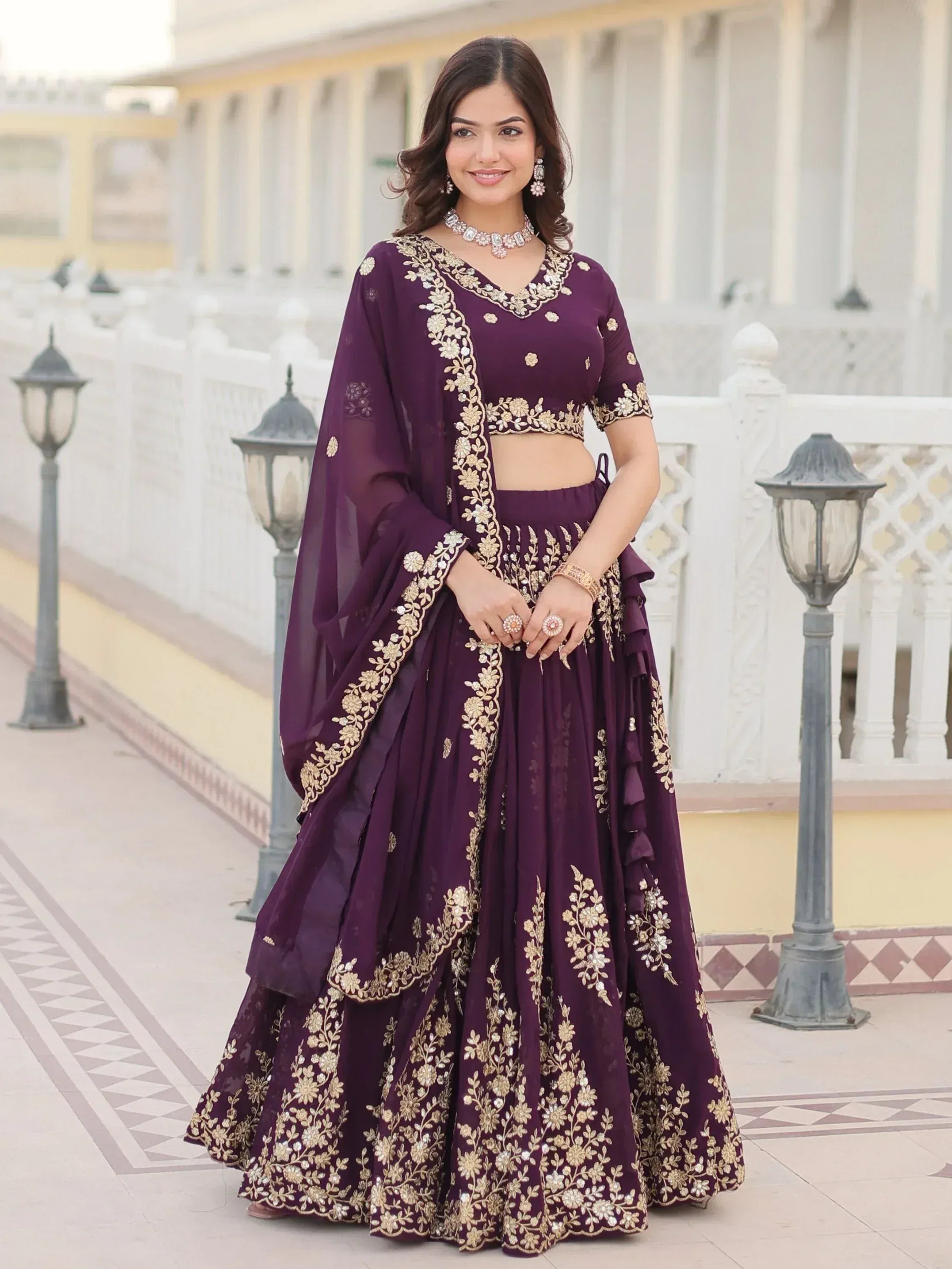 Elegant purple lehenga choli with gold floral embroidery, perfect for Indian ethnic wear occasions