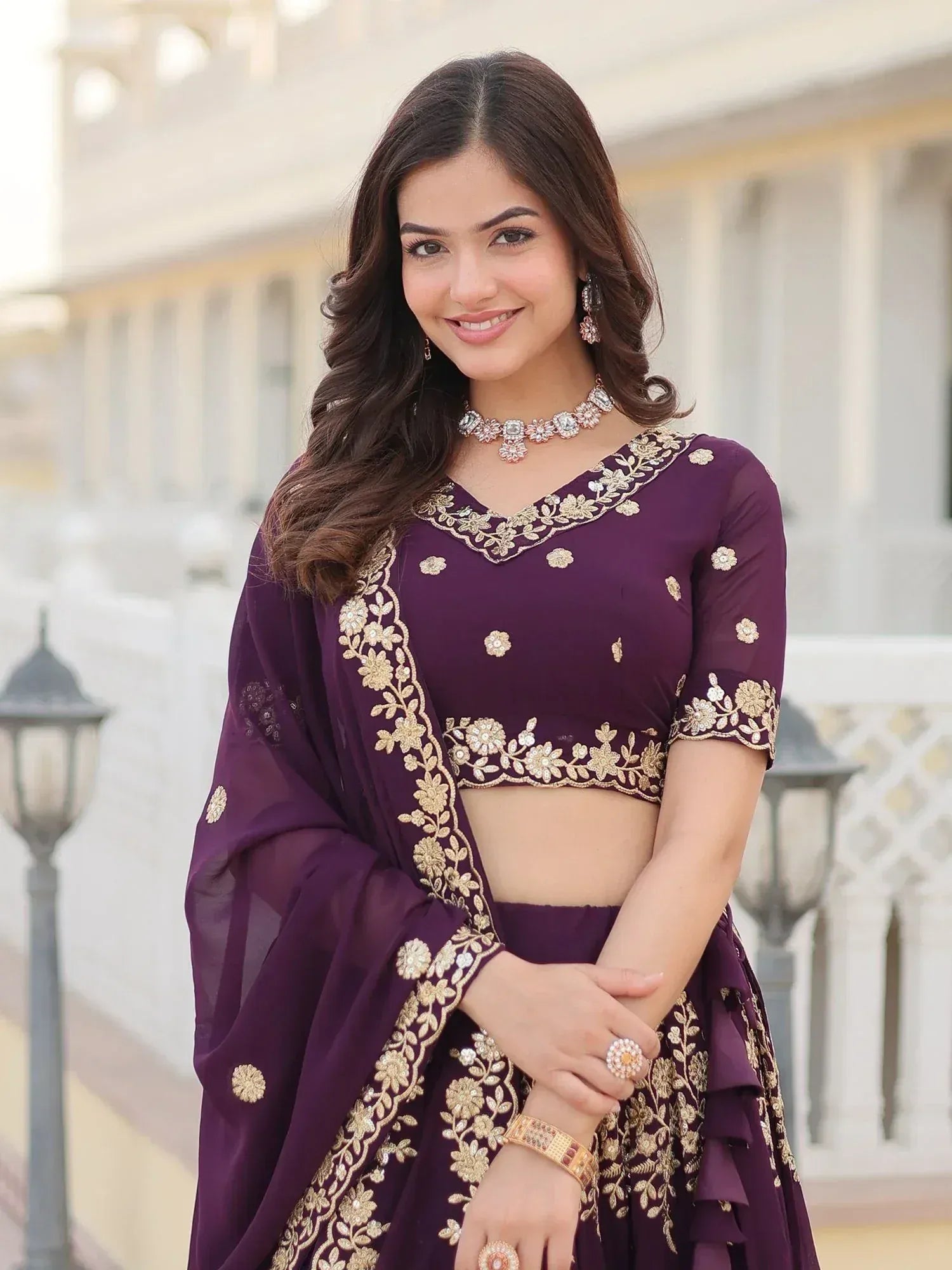 Purple embroidered lehenga choli with gold floral work, perfect for Indian ethnic occasions