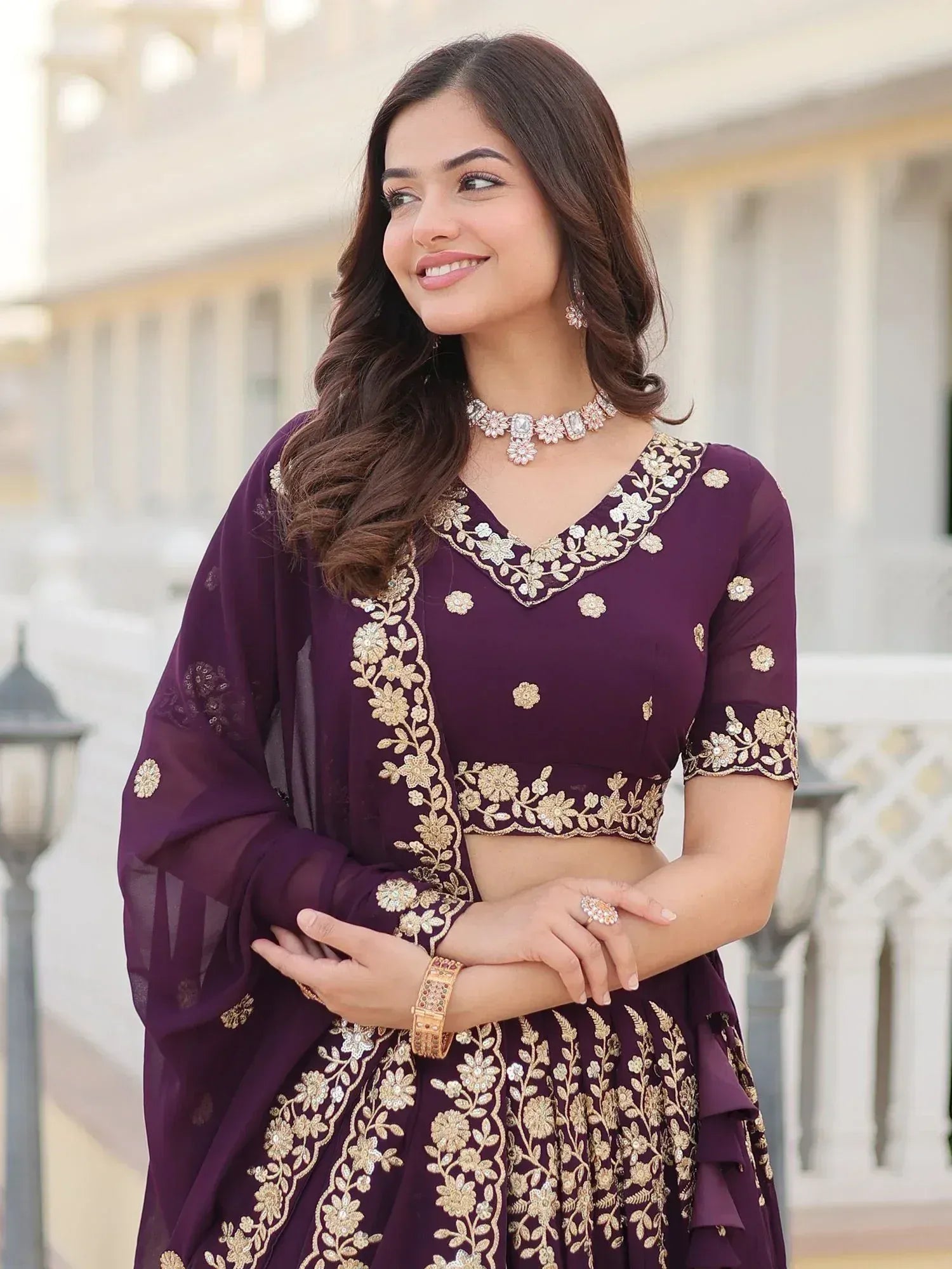 Elegant purple lehenga choli with gold floral embroidery, perfect for Indian ethnic occasions.