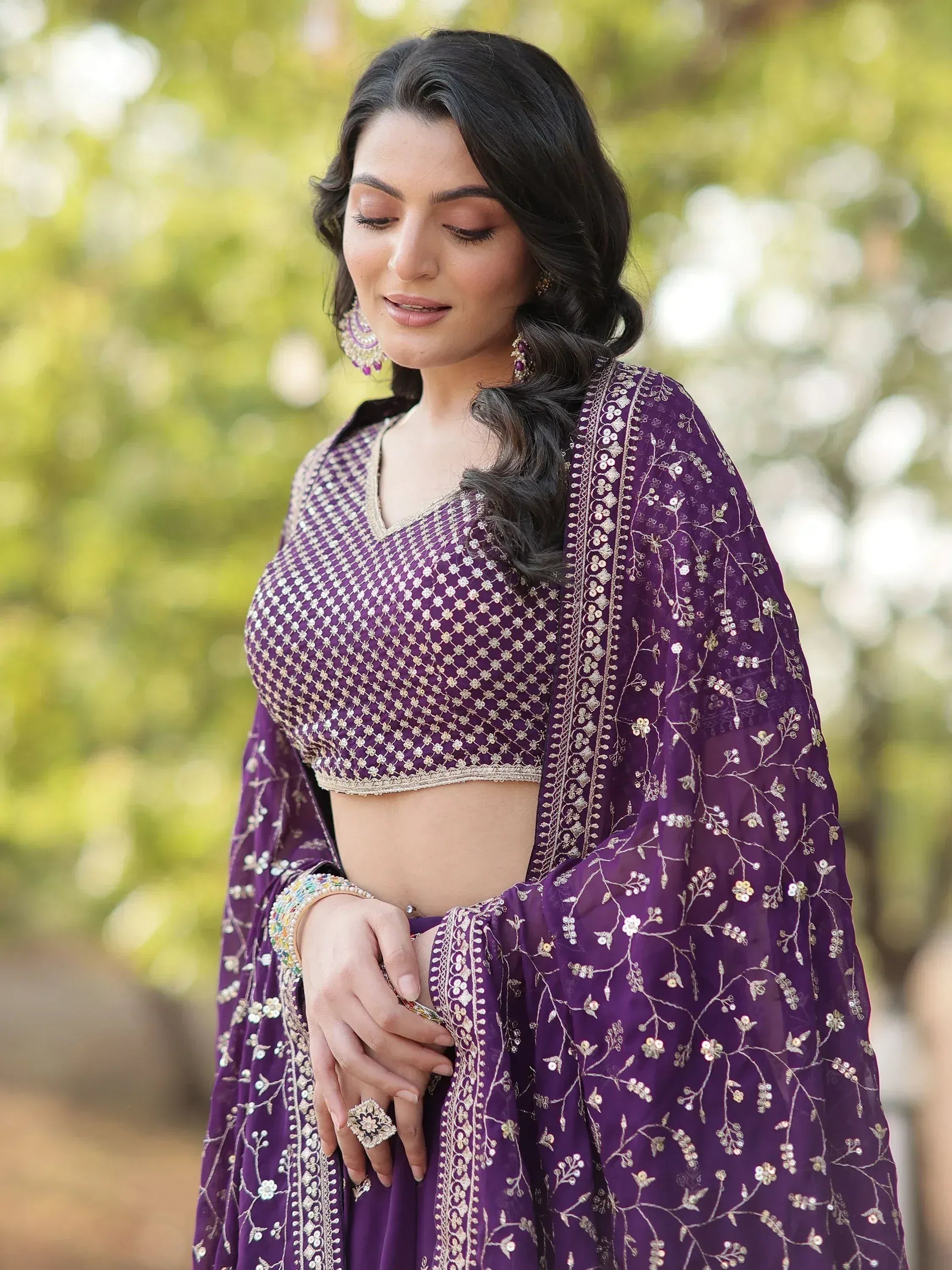 Purple embroidered lehenga choli with gold floral work, perfect for Indian ethnic wear occasions