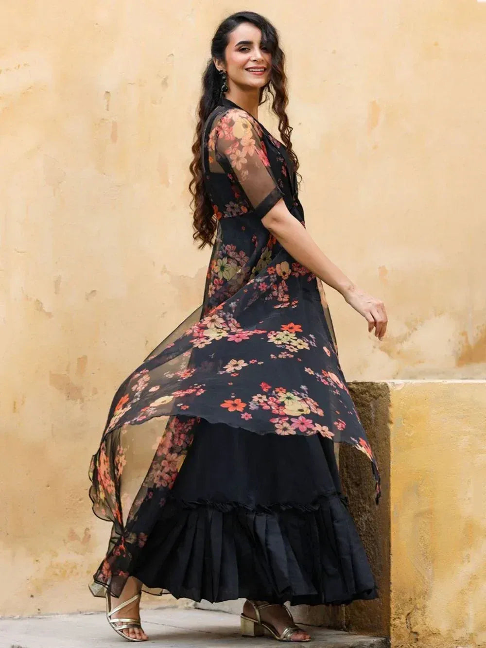 Black floral ethnic gown with sheer overlay and ruffled skirt, perfect for Indian occasions