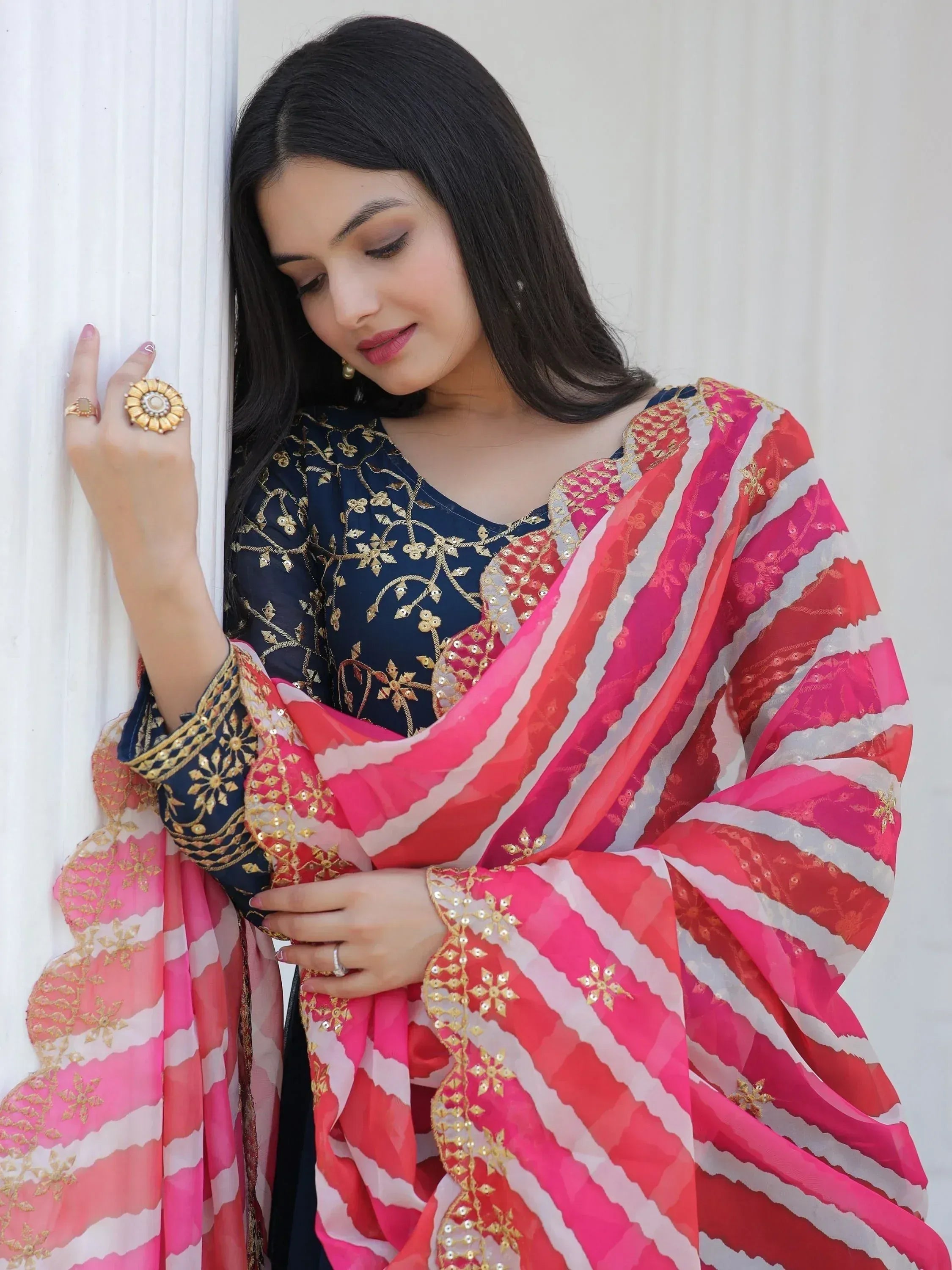 Woman in navy blue embroidered kurta with pink and white striped dupatta, Indian ethnic wear