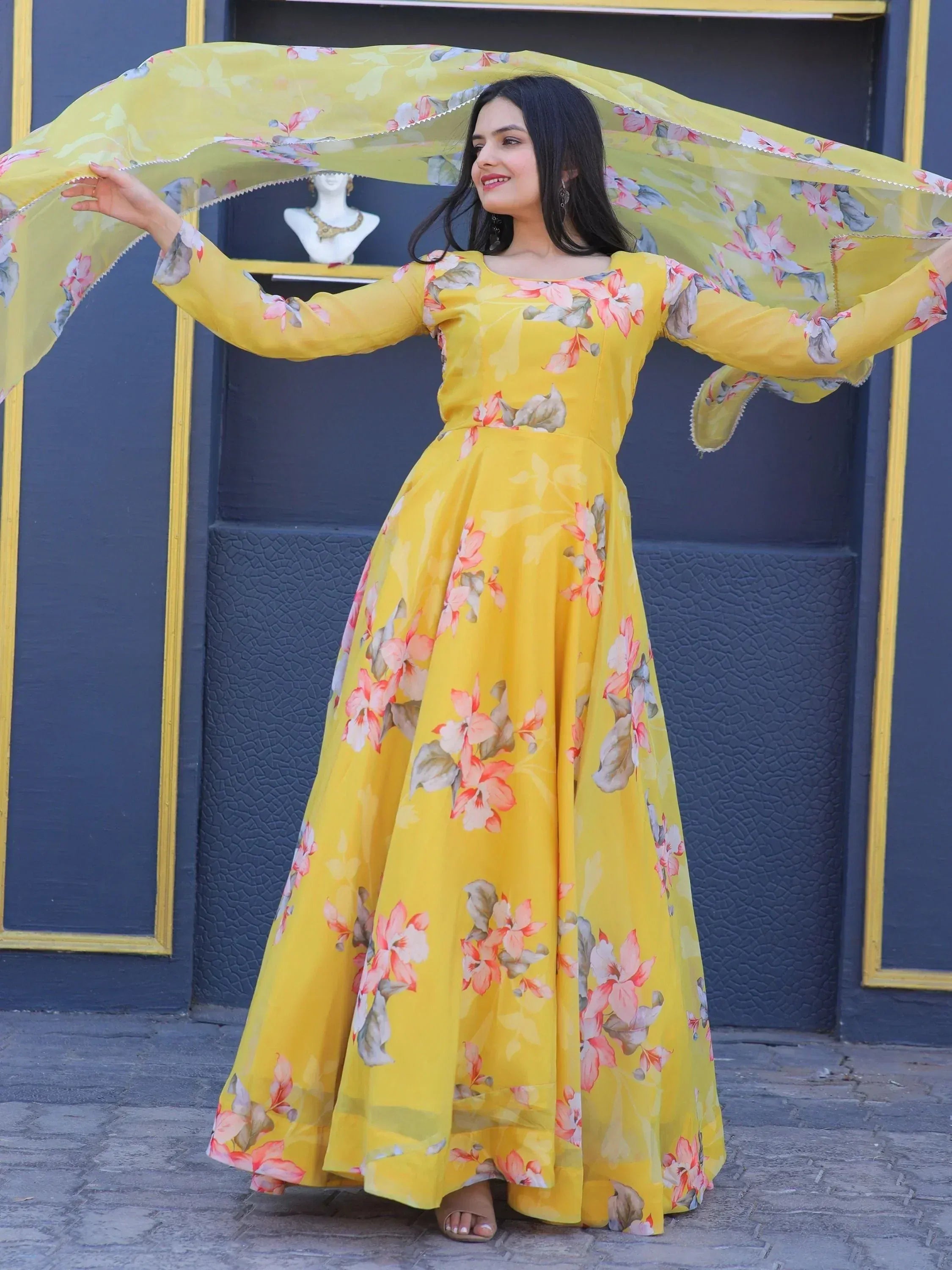 Yellow floral ethnic gown with matching dupatta, perfect for Indian occasions and festive wear.