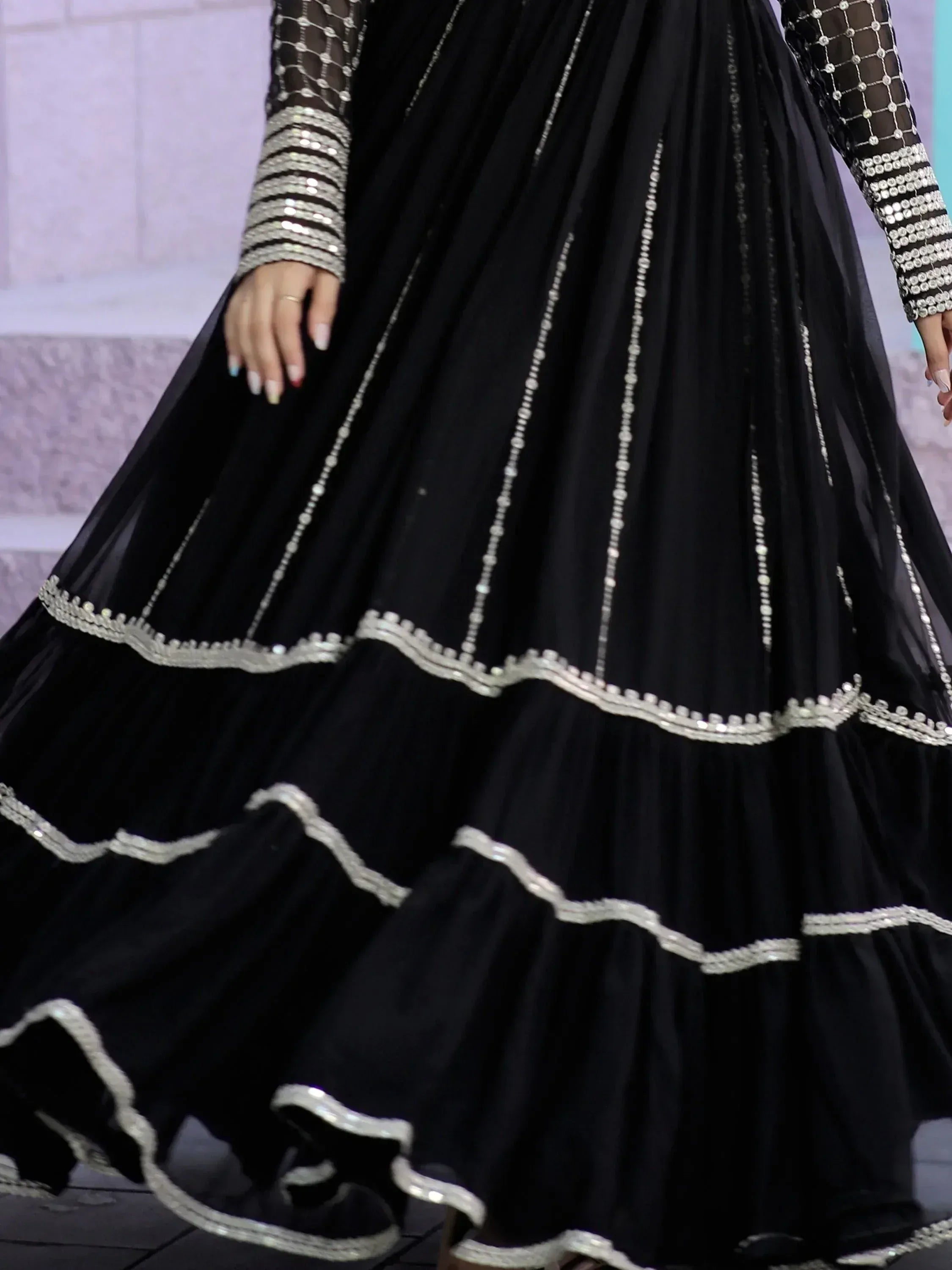 Black designer lehenga with silver embellishments and sheer sleeves, ethnic Indian wear