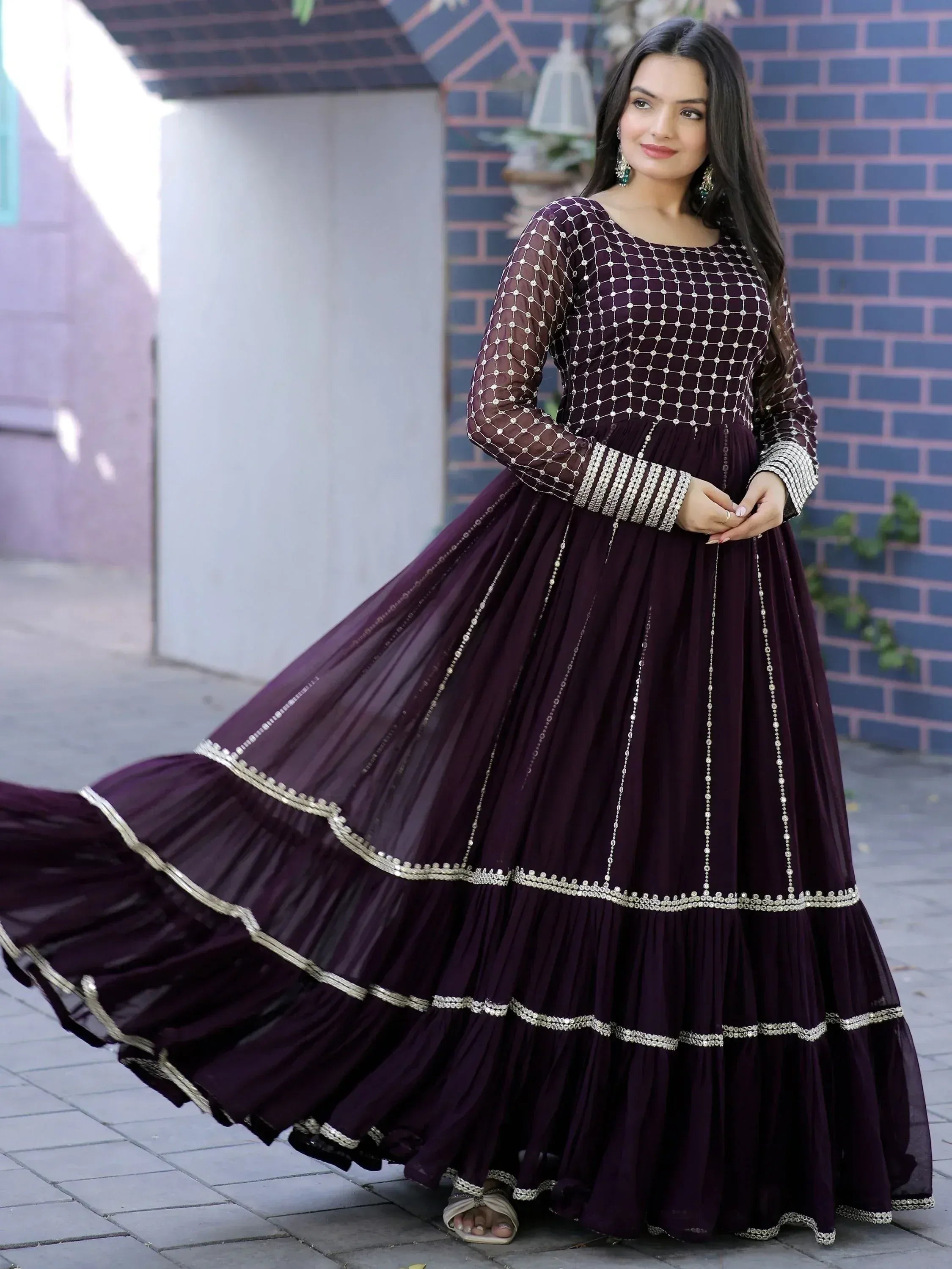 Elegant purple ethnic gown with net embroidery and pleated skirt, perfect for Indian occasions