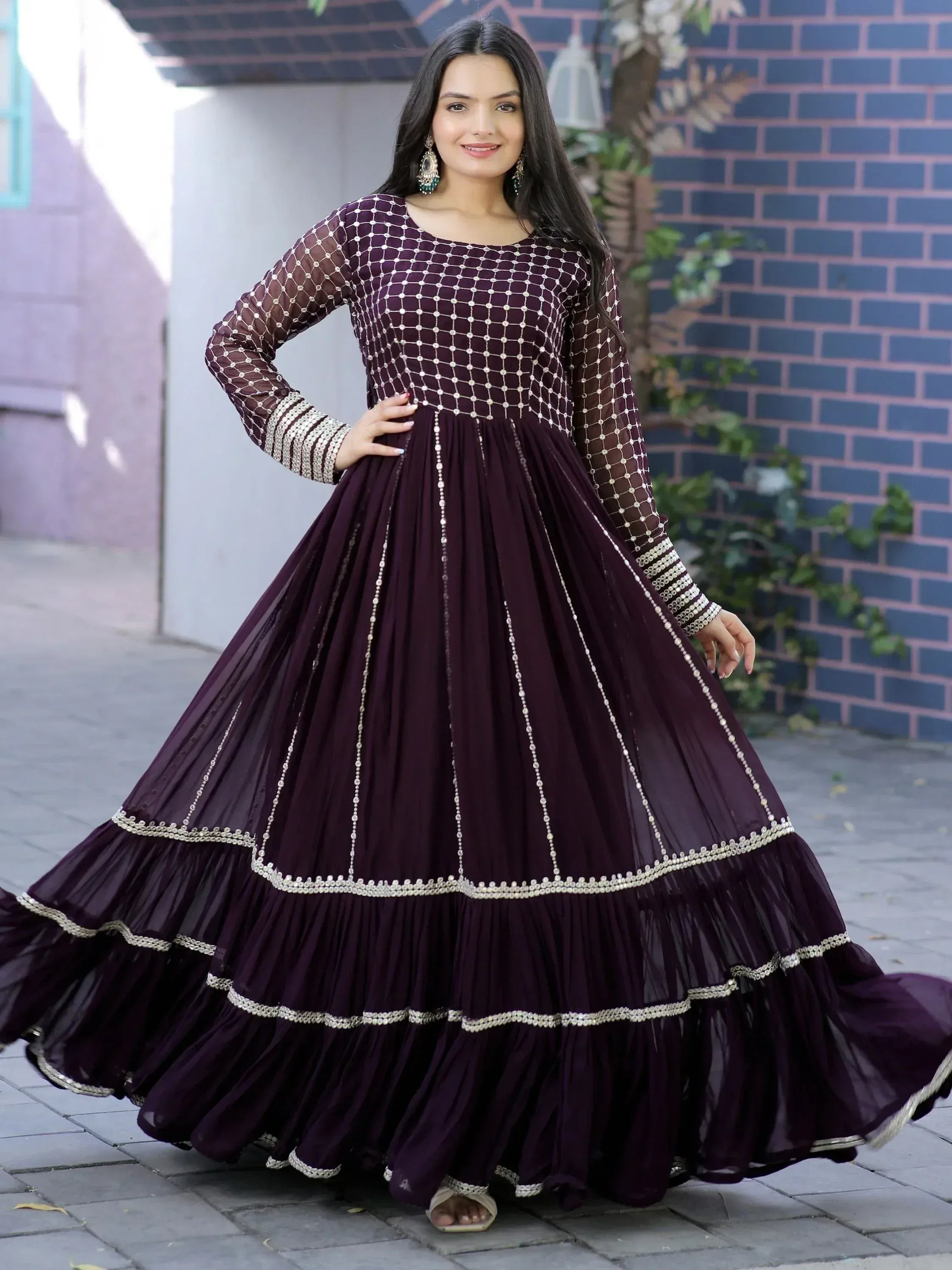 Elegant purple ethnic gown with gold embroidery, perfect for Indian weddings and festive occasions